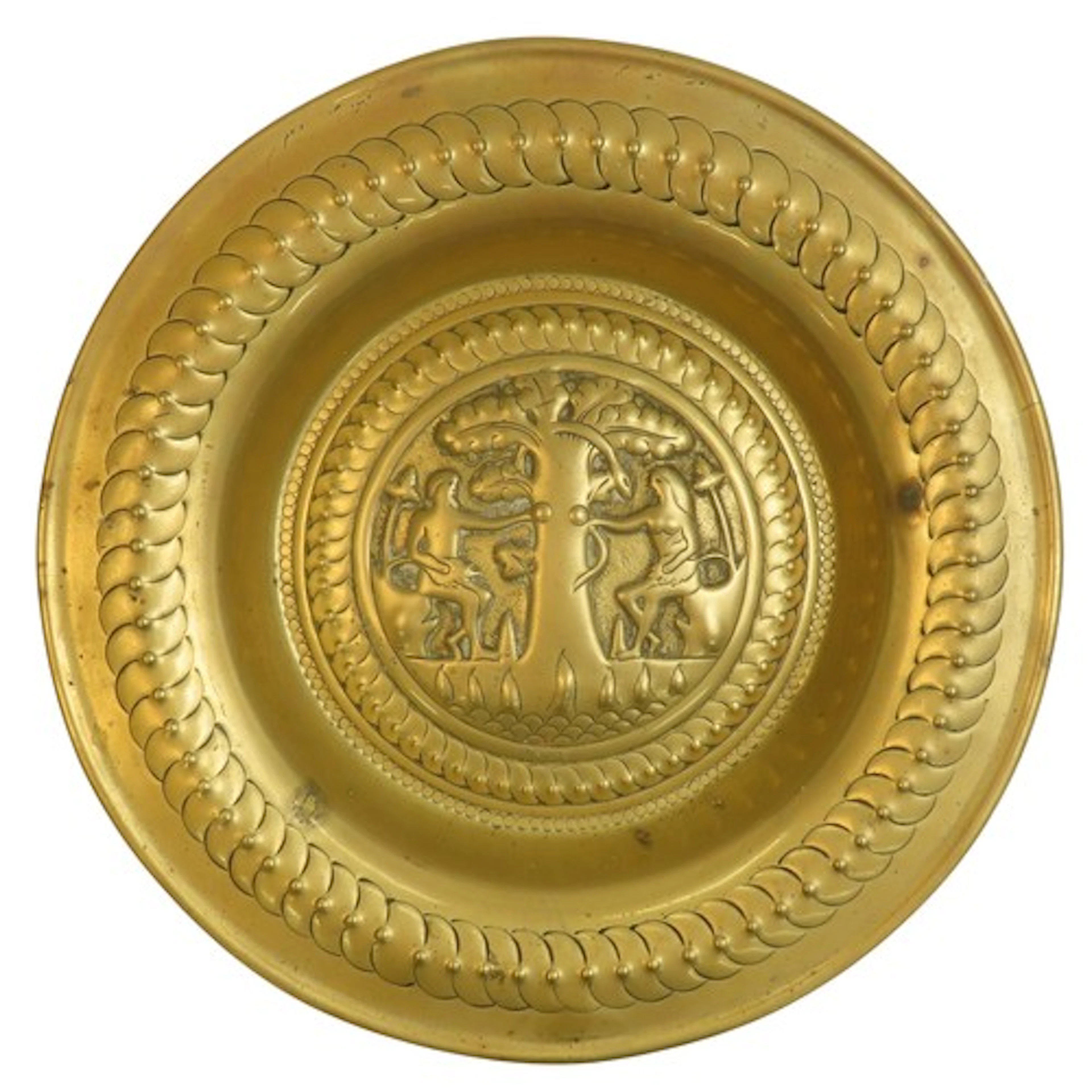 A NUREMBERG TYPE BRASS ADAM & EVE CHARGER or dish, proba...
