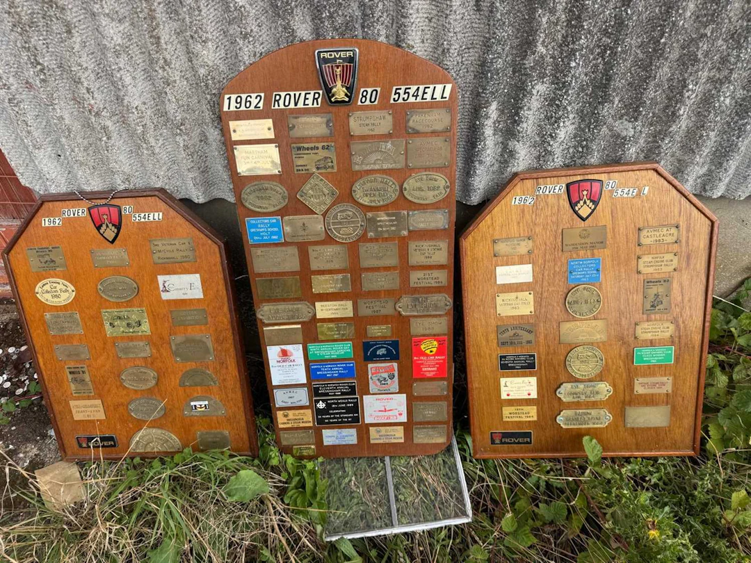 ROVER BADGES ON WOODEN BOARDS