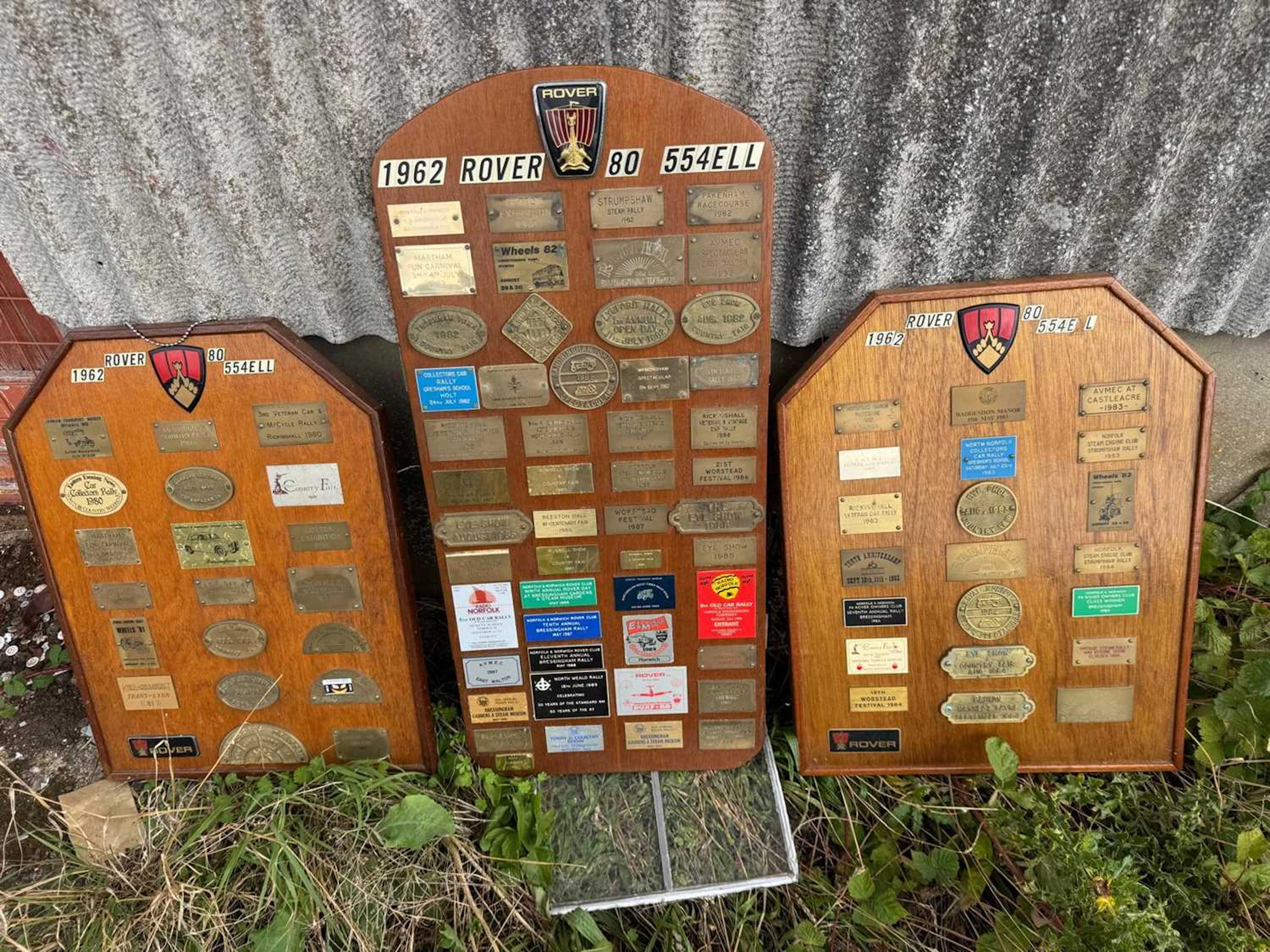 ROVER BADGES ON WOODEN BOARDS