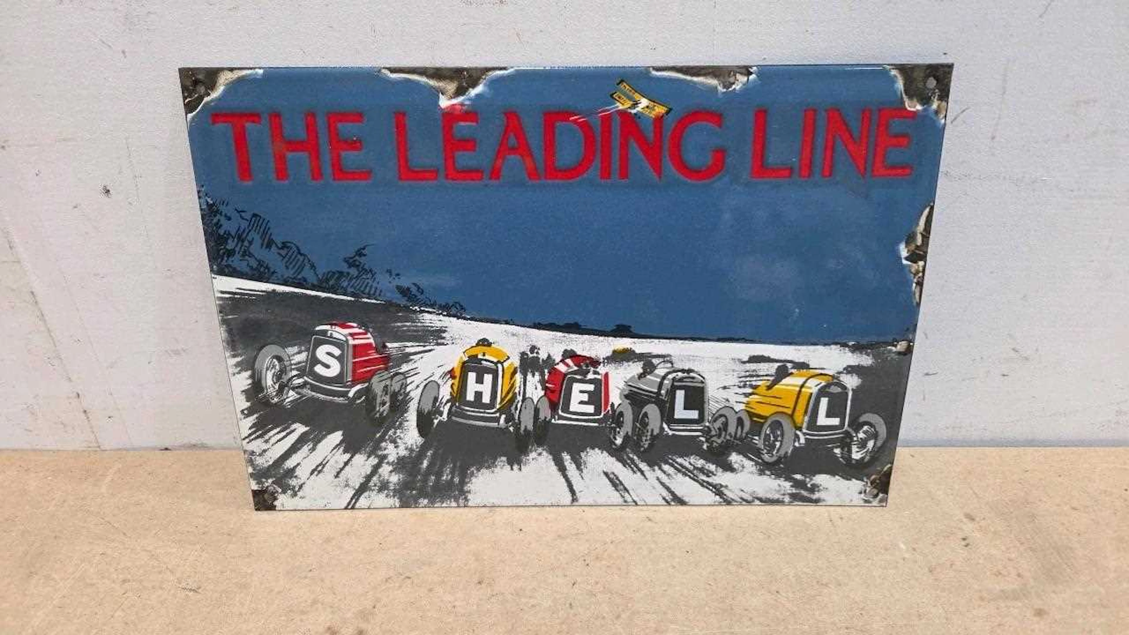 THE LEADING LINE REPRO ENAMEL SIGN 15" X 10"
