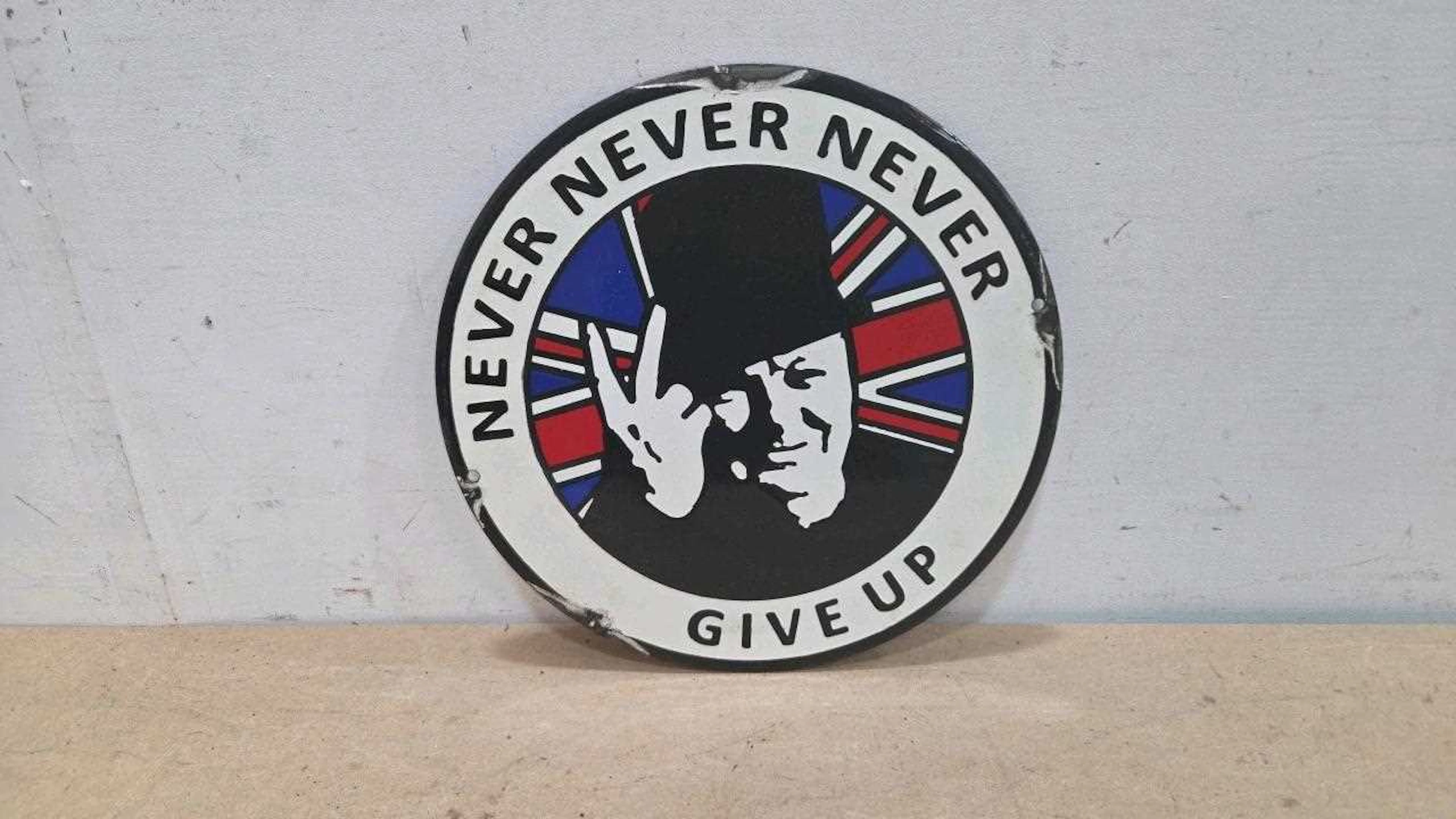 NEVER NEVER GIVE UP REPRO ENAMEL SIGN 12" DIA