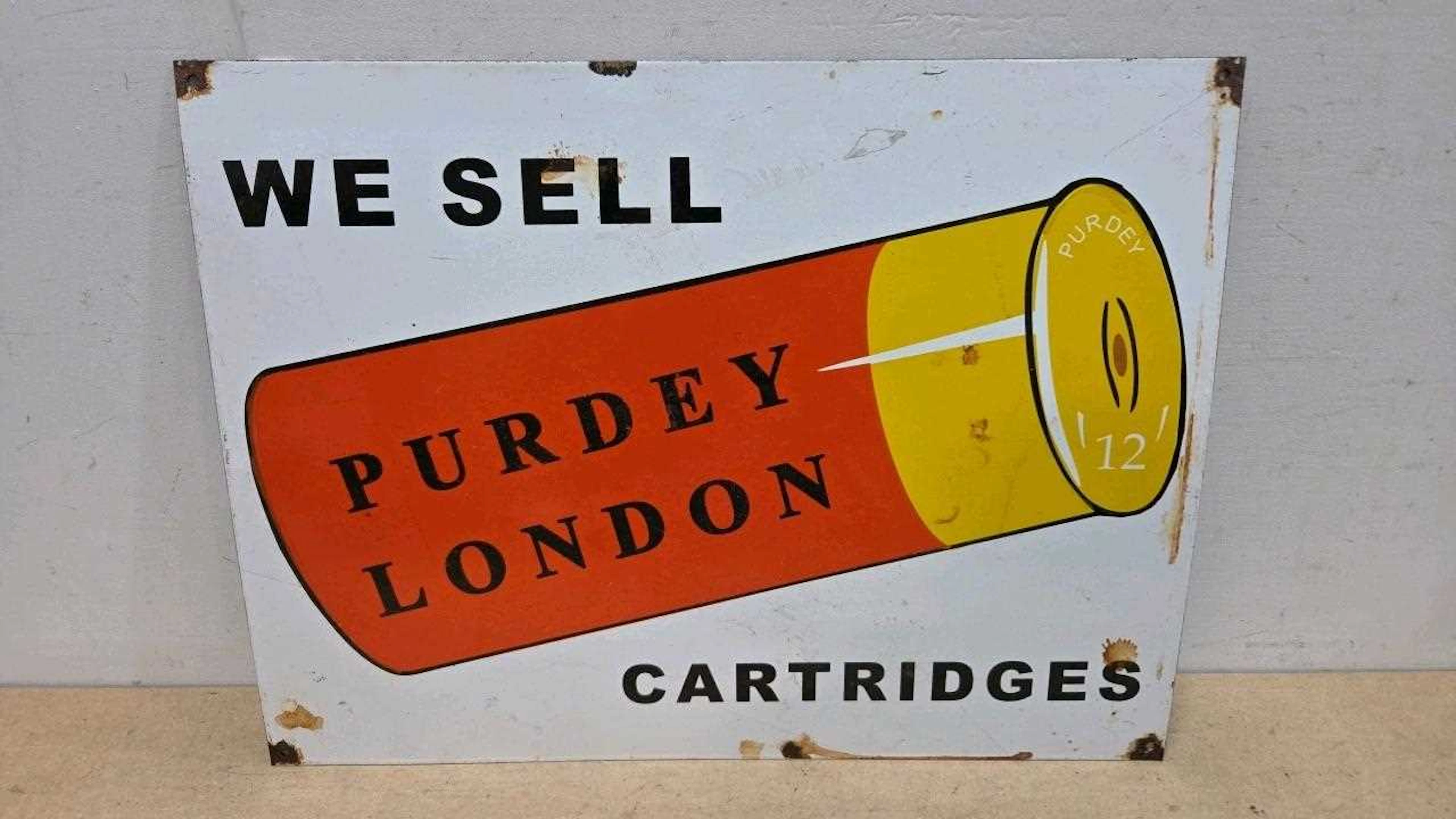 WE SELL PURDEY CARTRIDGES , ENAMEL REPRO SIGN 24" X 18"