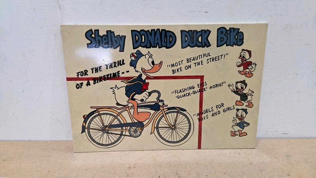 SHELBY DONALD DUCK BIKE, WOODEN HAND PAINTED SIGN 24" X 16"