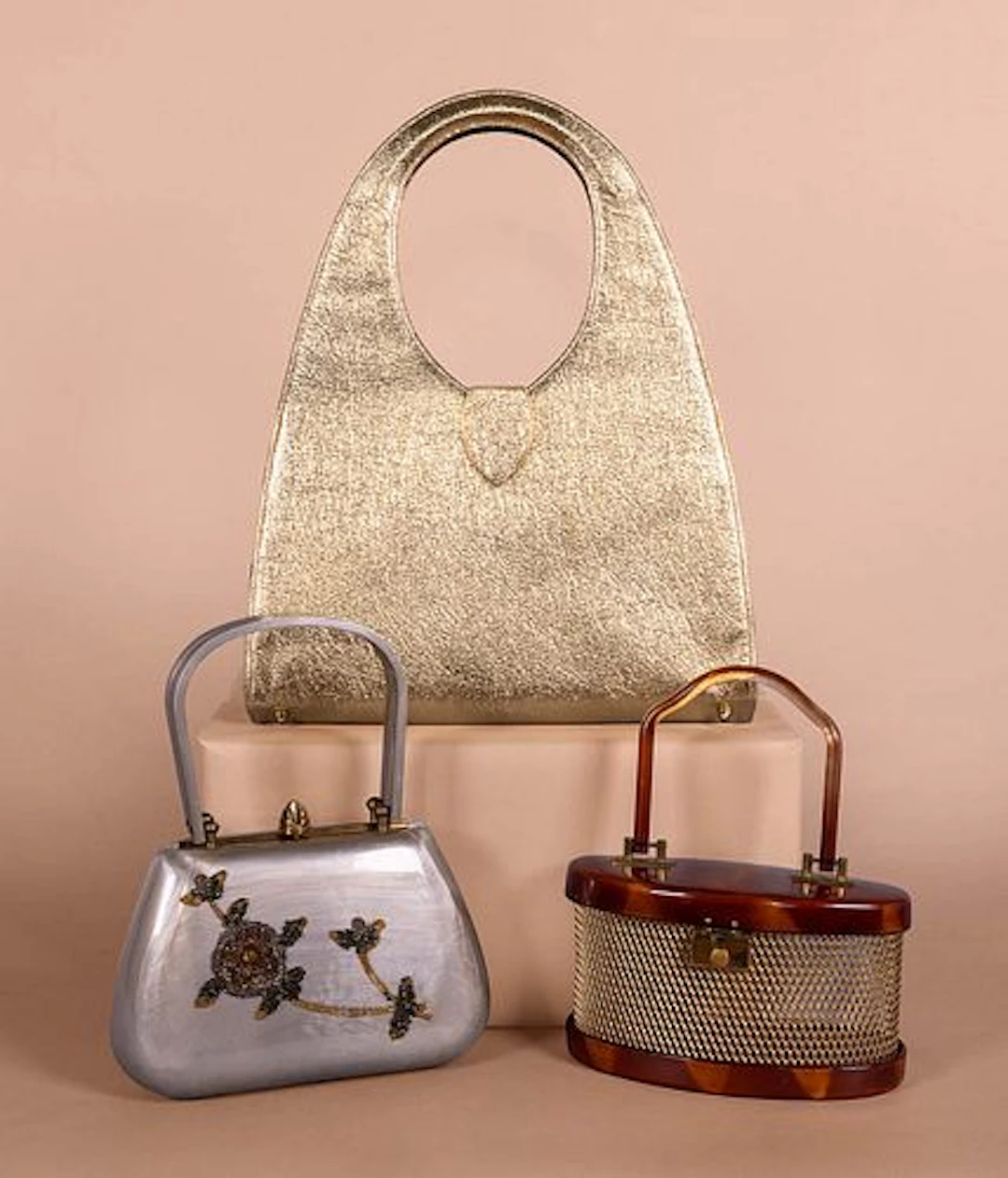 THREE LUCITE OR LEATHER METALLIC HANDBAGS, 1950S