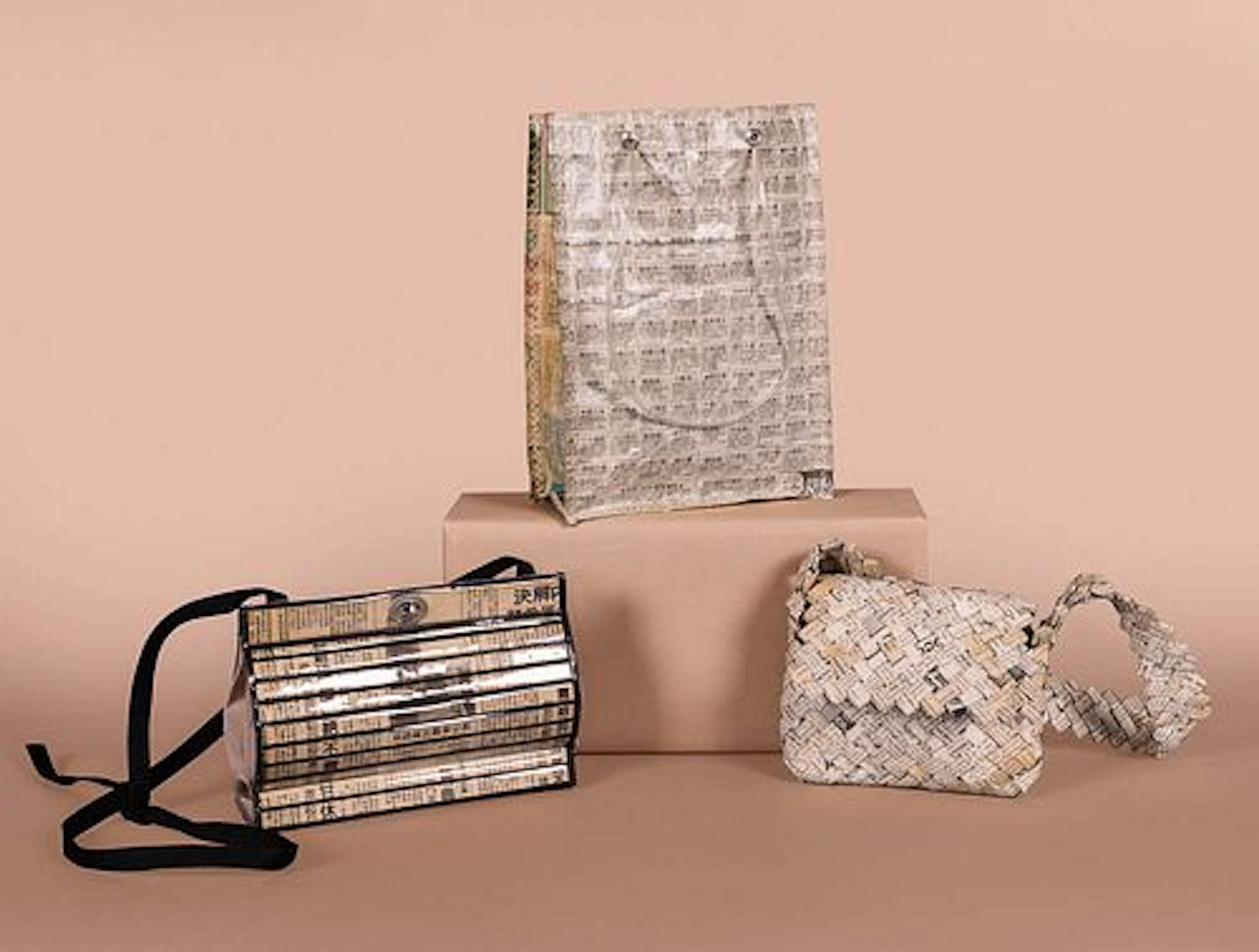 THREE NOVELTY NEWSPRINT HANDBAGS, 1970S - 2000S