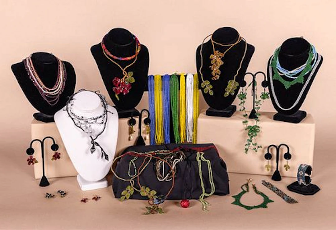 GENEROUS LOT OF FLORAL AND FOLIATE BEADED COSTUME JEWELRY