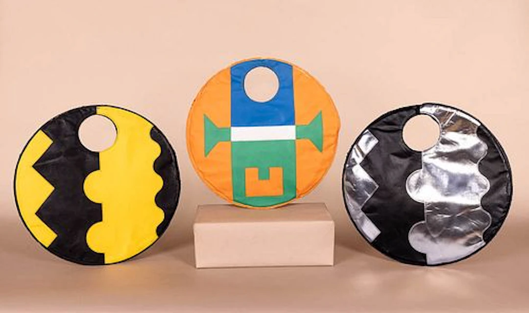 THREE CIRCULAR MOD VINYL HANDBAGS, 1960S