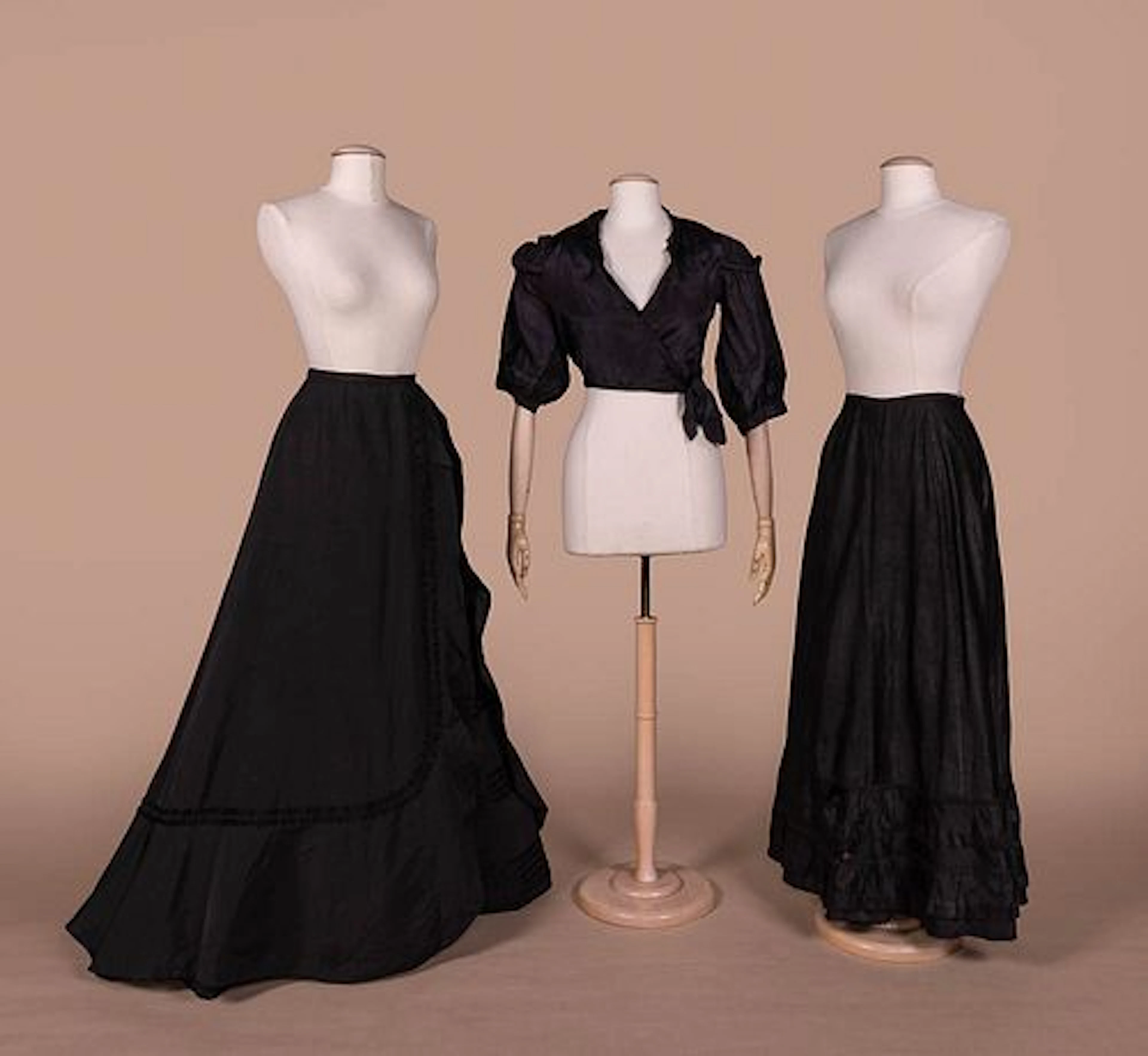 THREE ANTIQUE BLACK SEPARATES, 1890S -1930S