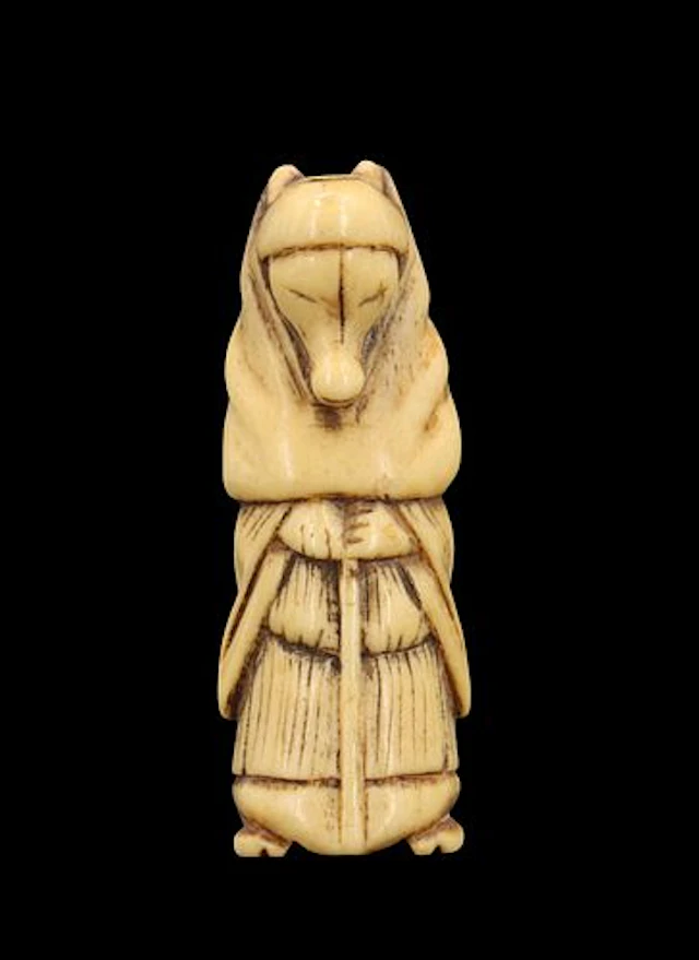 Carved Bone Netsuke of a Fox Disguised as a Priest