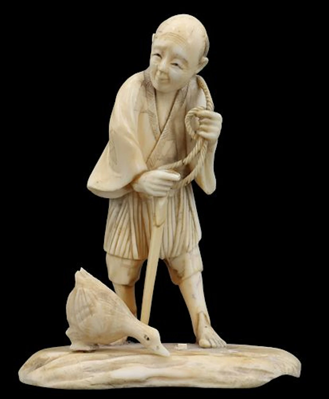 Antique Japanese Finely Carved Okimono of a Man with a Duck