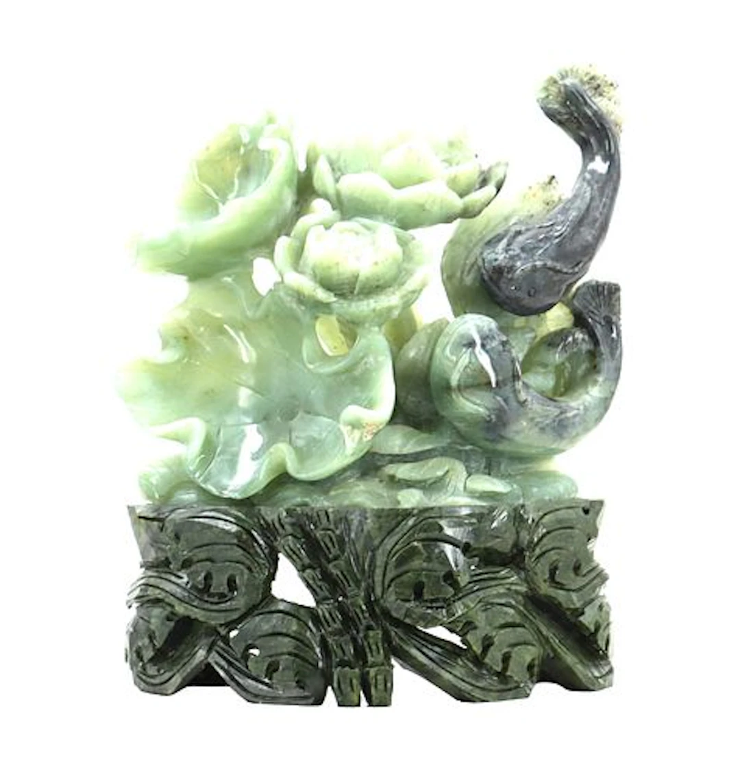 Intricate Jade Carving of Fish and Flowers