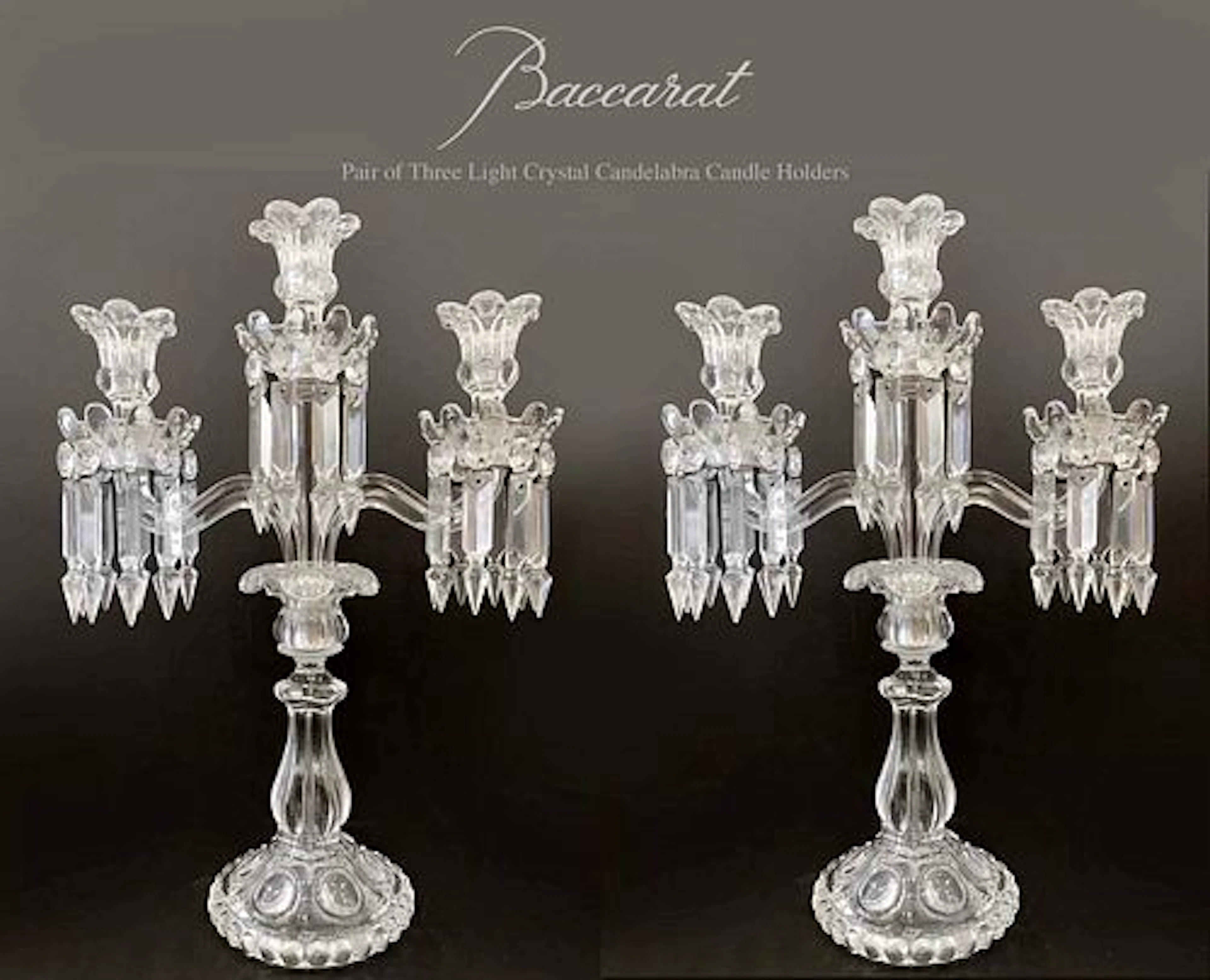 A Pair of French Baccarat Three light Crystal Candelabra, signed