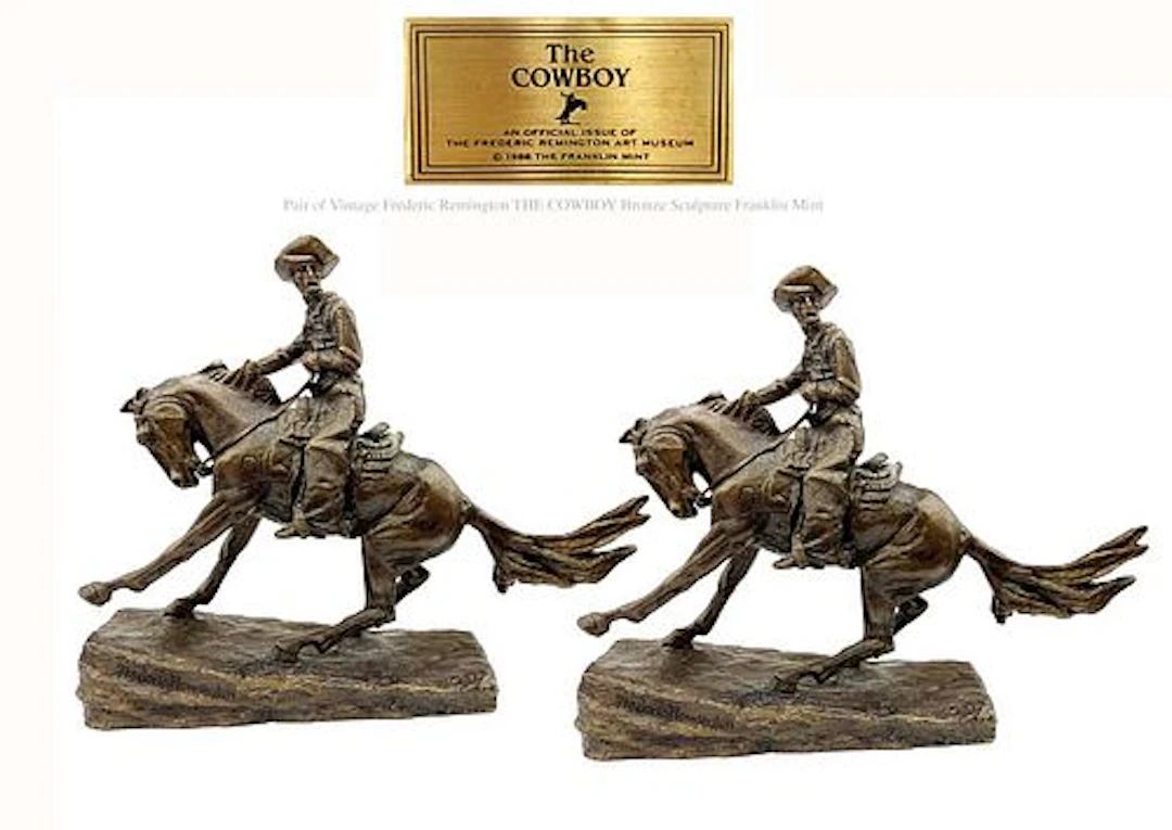 A Pair of Vintage Fredric Remington Signed The Cowboy Bronze Statues