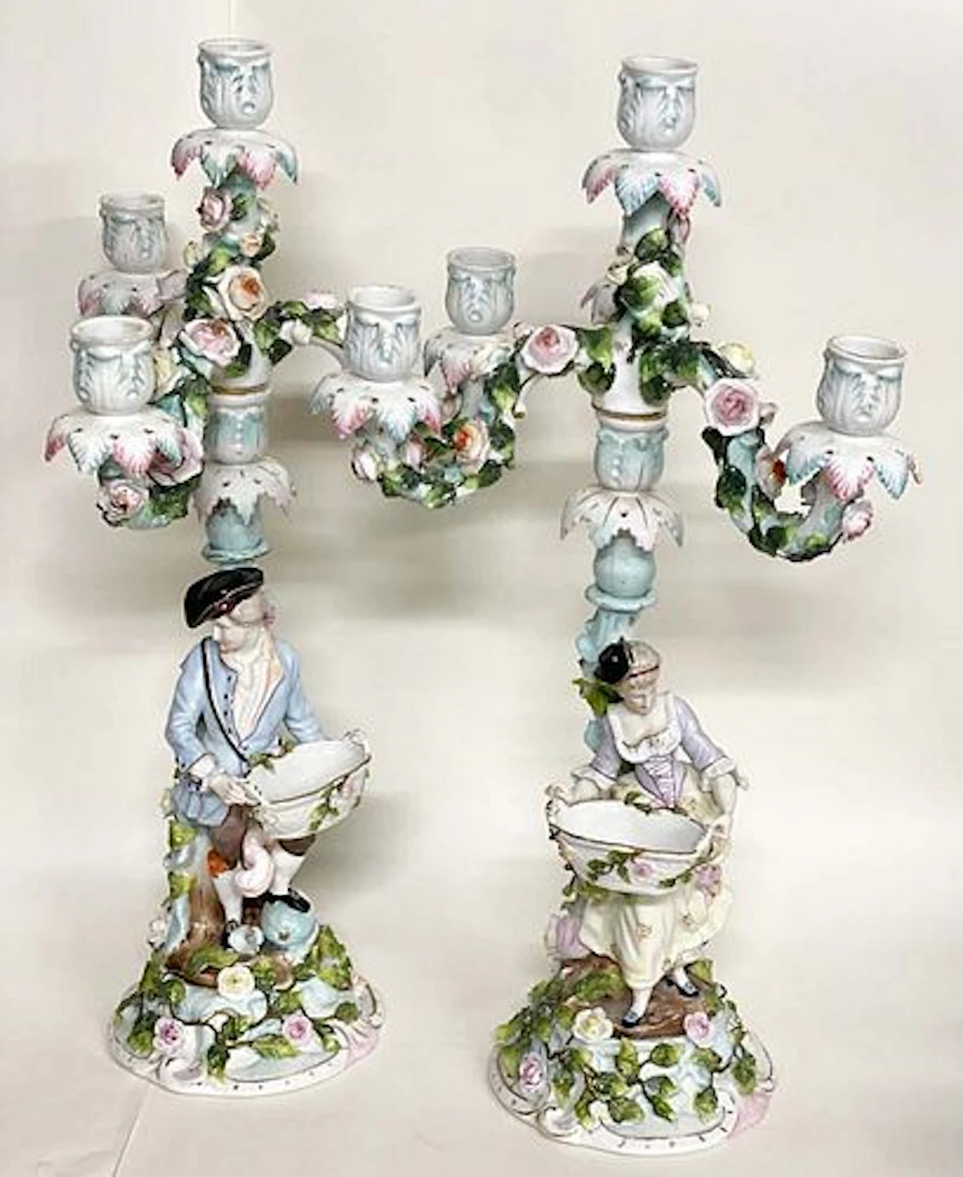A Pair of Meissen style Figural Porcelain Candelabras