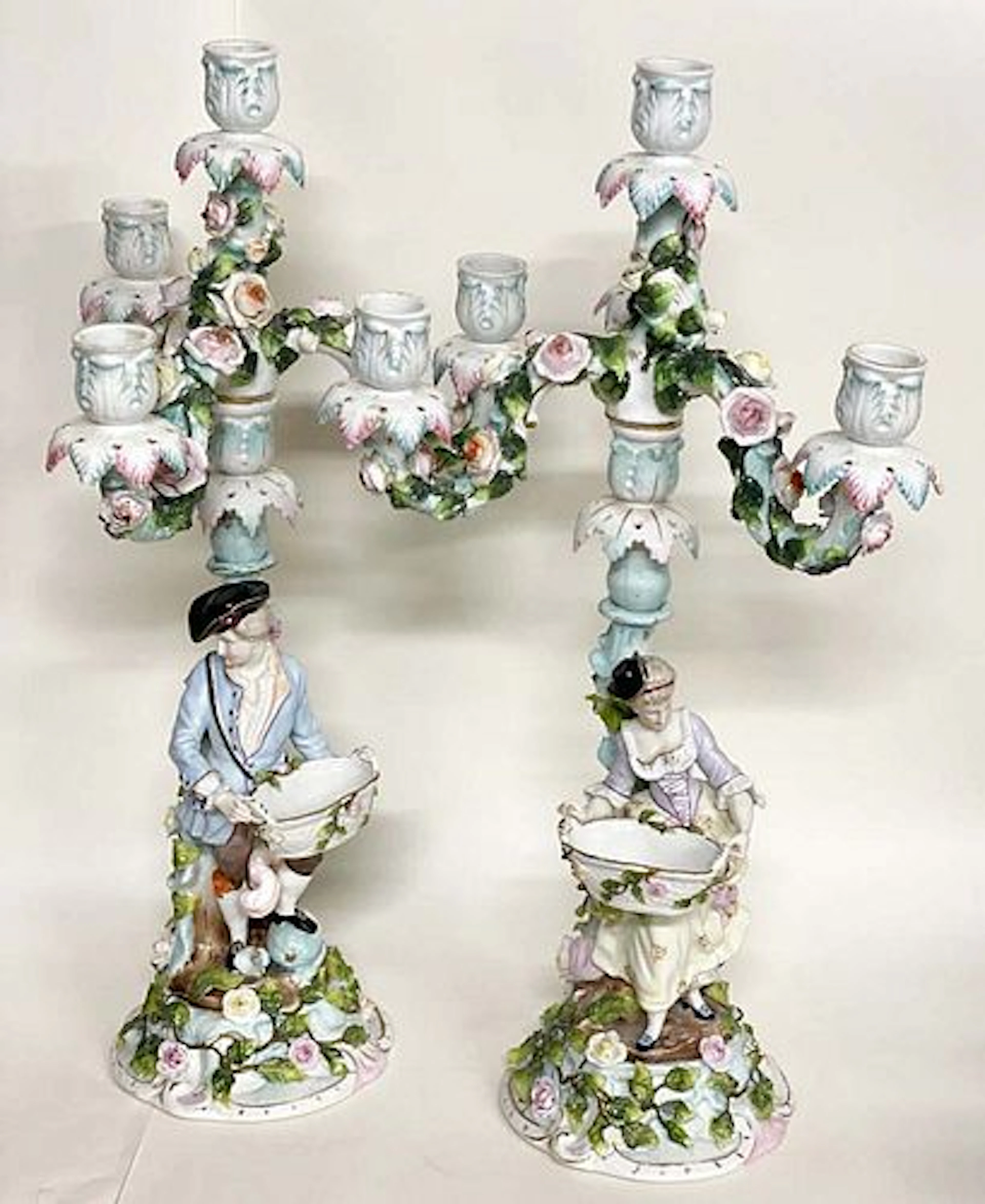 A Pair of Meissen style Figural Porcelain Candelabras