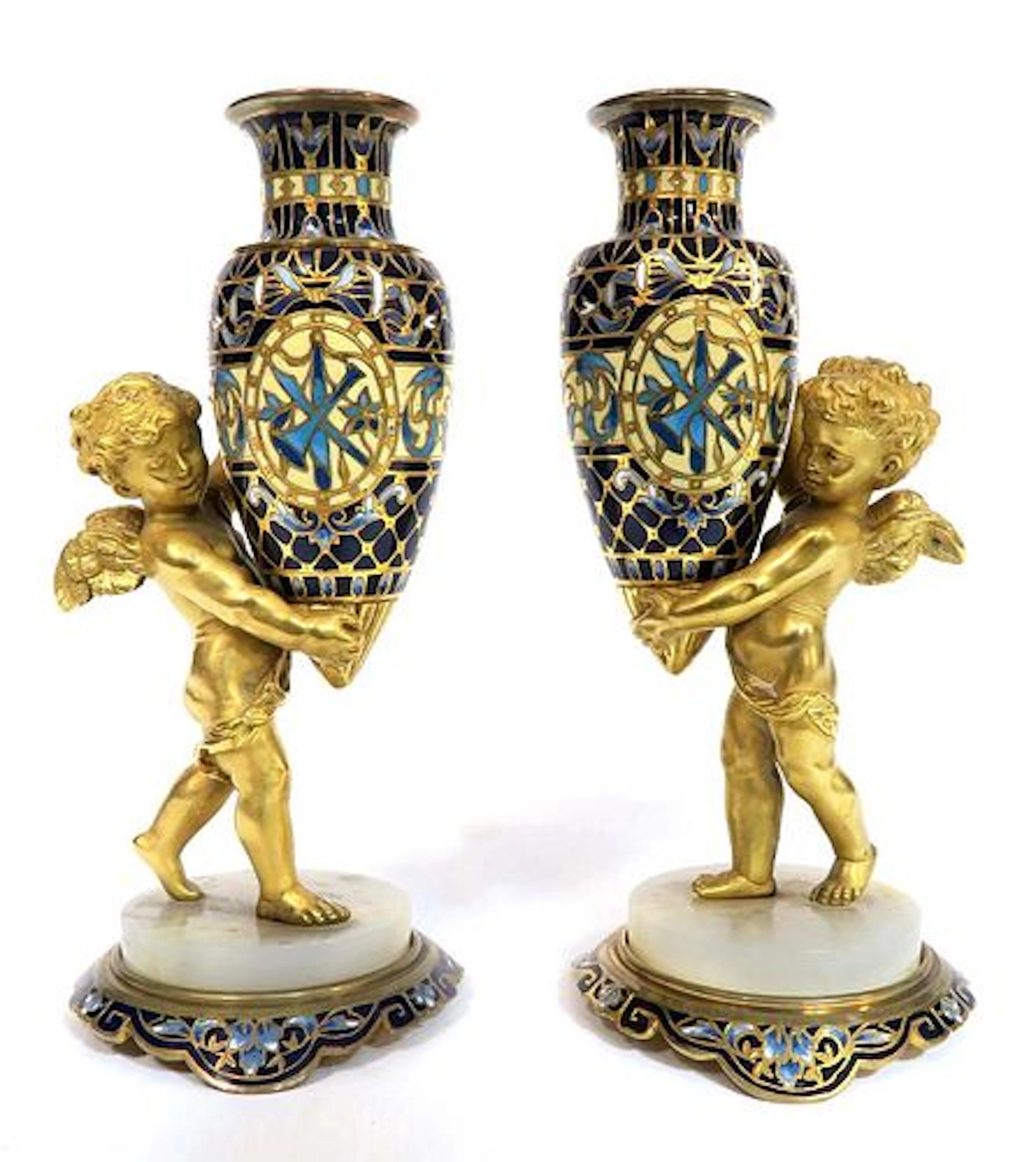 A PAIR OF BRONZE ORMOLU CHAMPLEVE ENAMEL CHERUB VASES