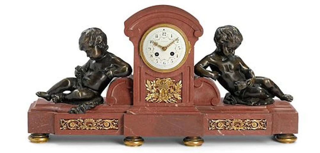 A Tiffany & Co. Gilt Bronze and Rouge Marble Clock