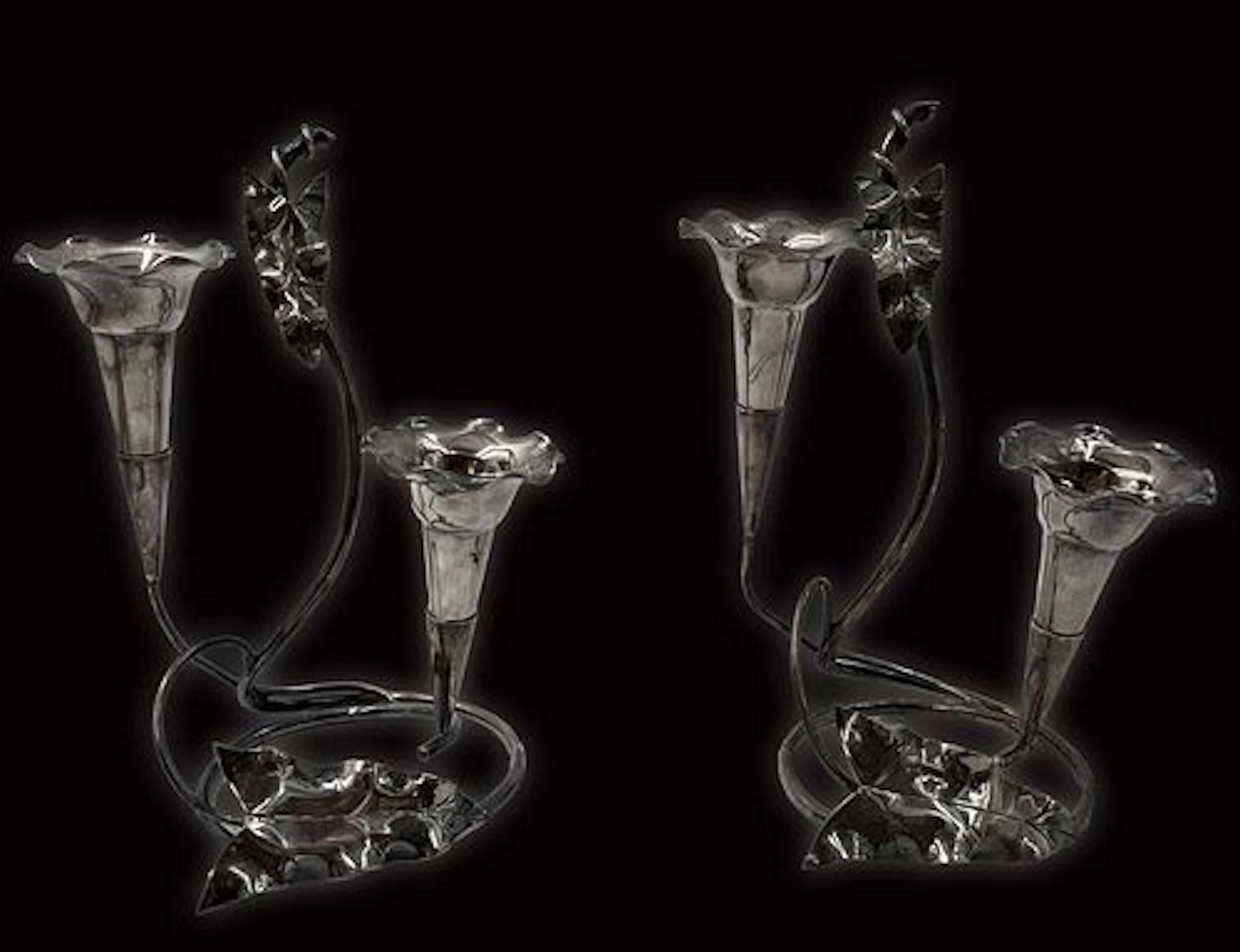 A Pair Of Silver-Plate Candelabras
