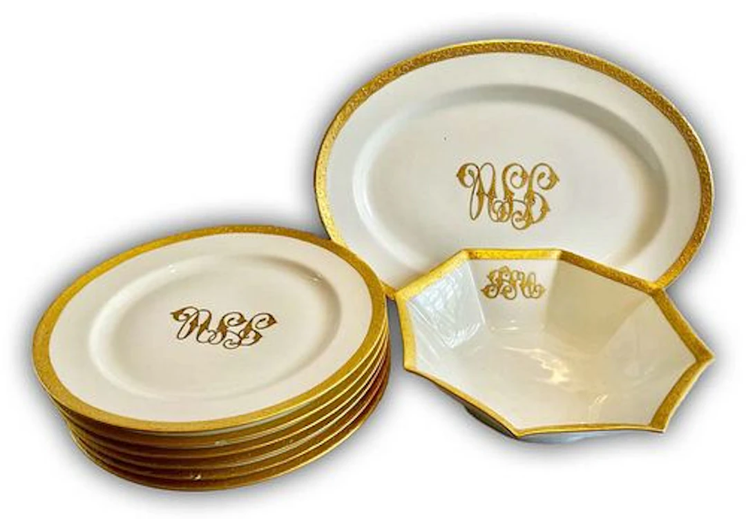 A Set Of Eight French Haviland Monogram Gilded Porcelain Dining Service