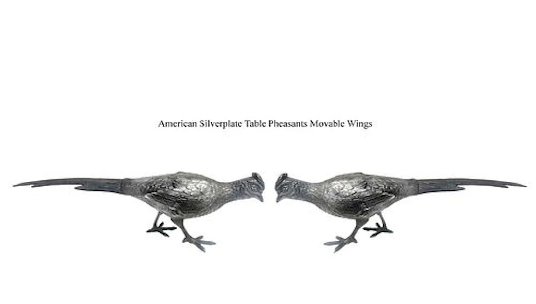 A Pair Of American Wallace Silver-Plated Movable Wings Pheasant Figurines