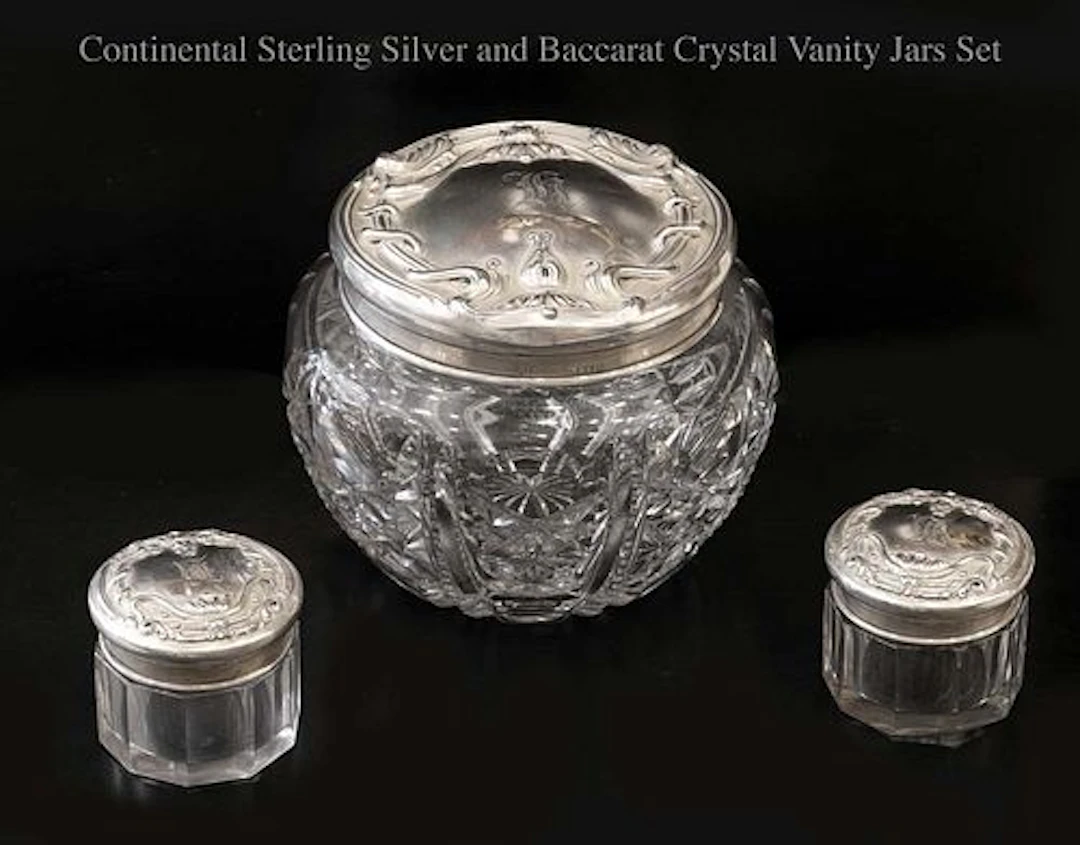 A Set of Three Continental Sterling silver & Baccarat Crystal Vanity Jars