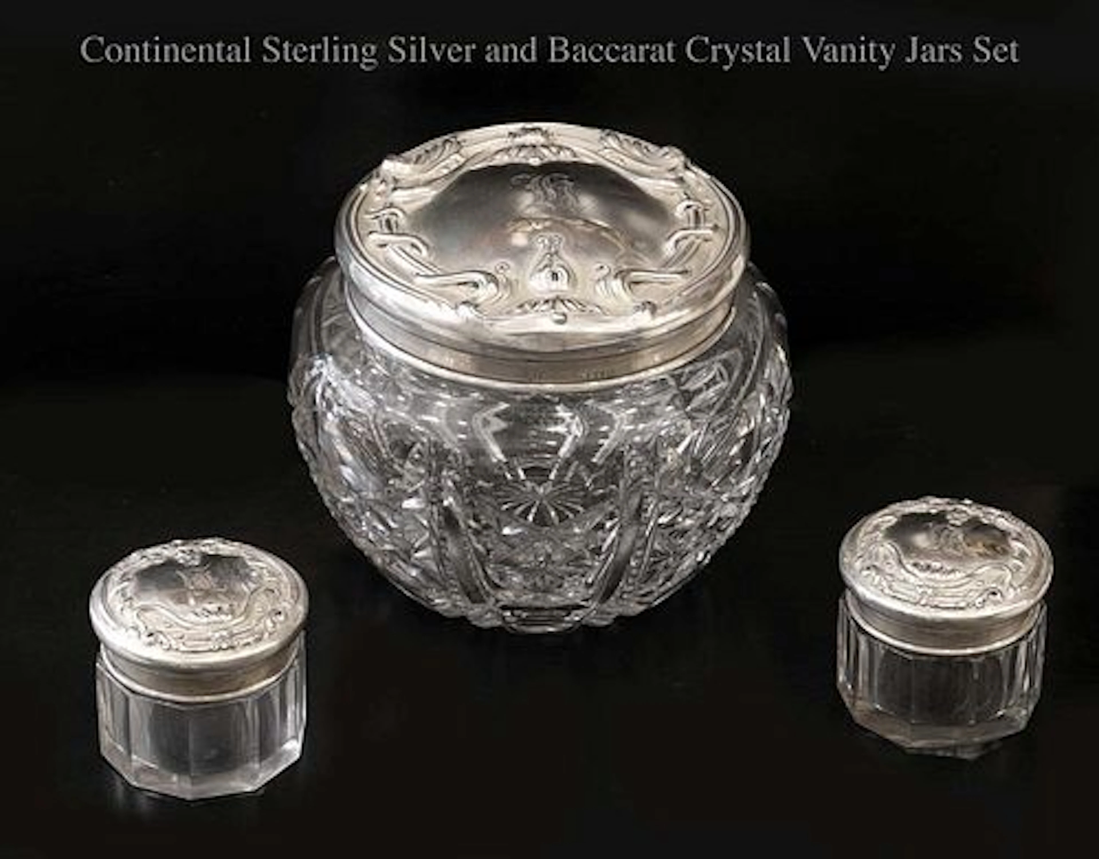 A Set of Three Continental Sterling silver & Baccarat Crystal Vanity Jars