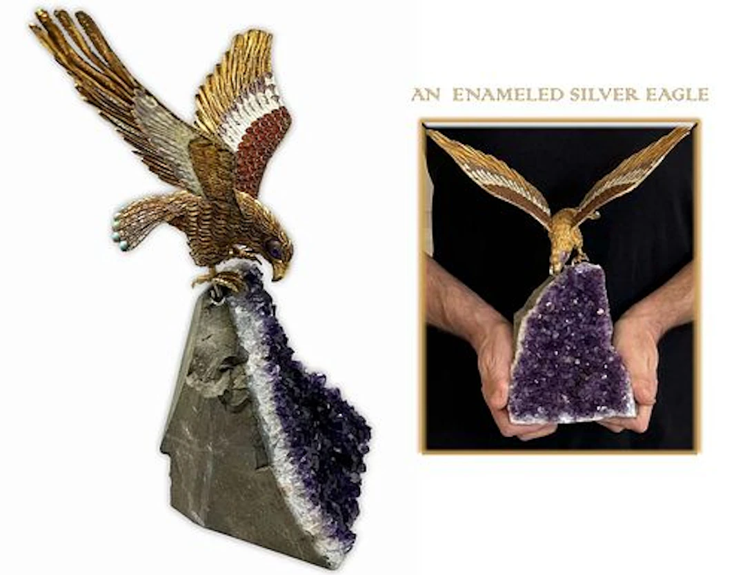 AN ENAMELED JEWELED SILVER FIGURINE OF EAGLE ON STONE