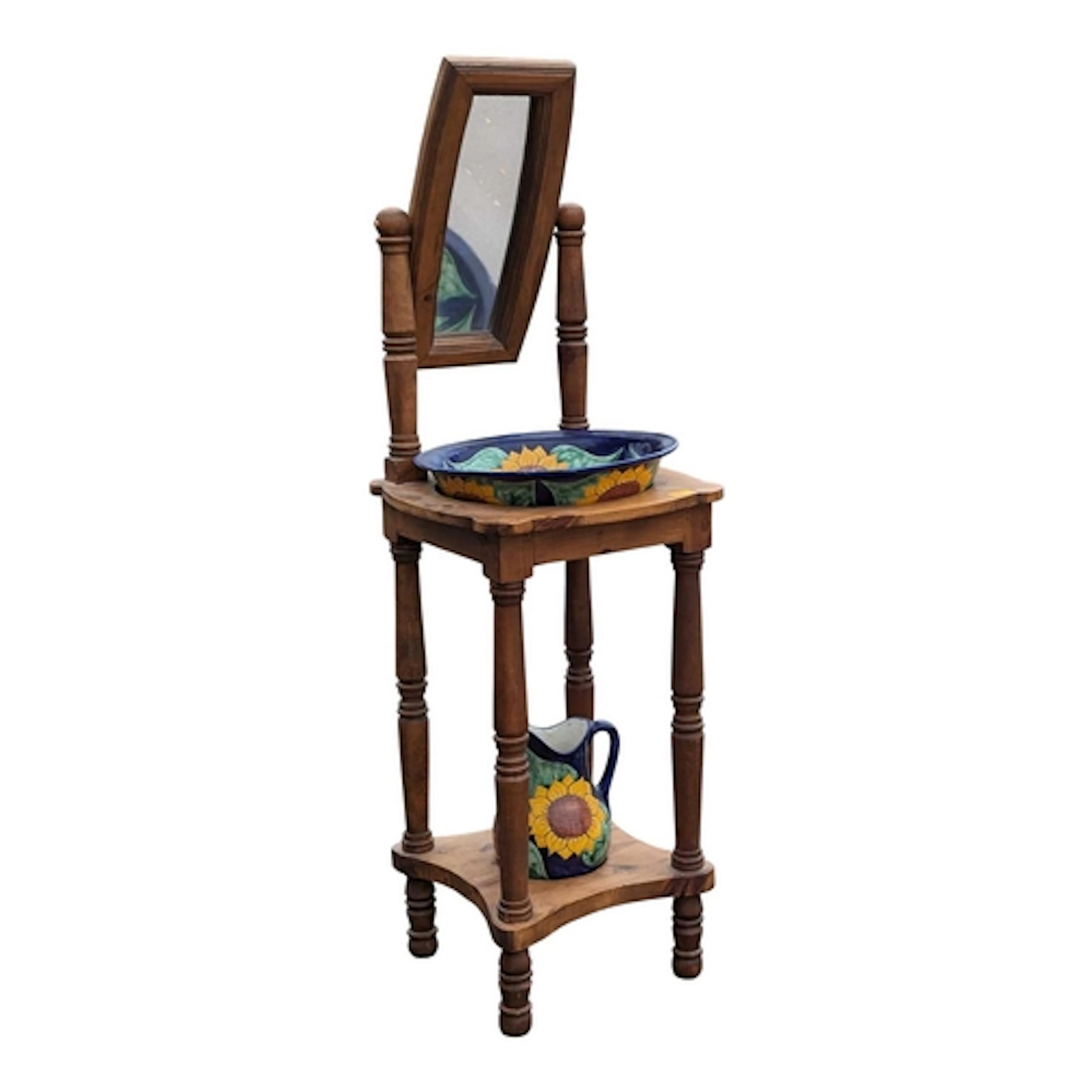 A vintage 20th century Mexican pine wash stand. Having a swi...