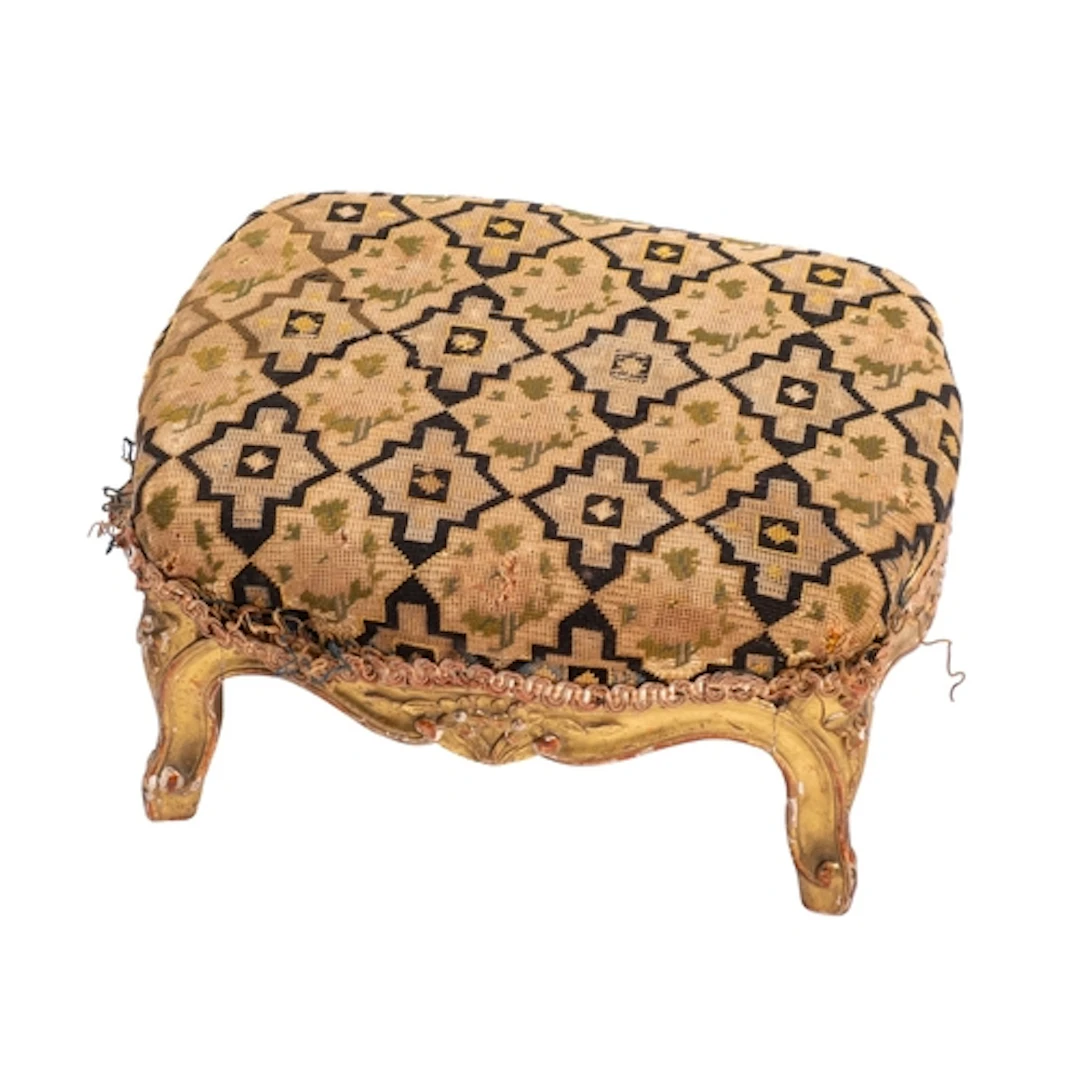 An Italian carved giltwood and upholstered footstool in 18th...