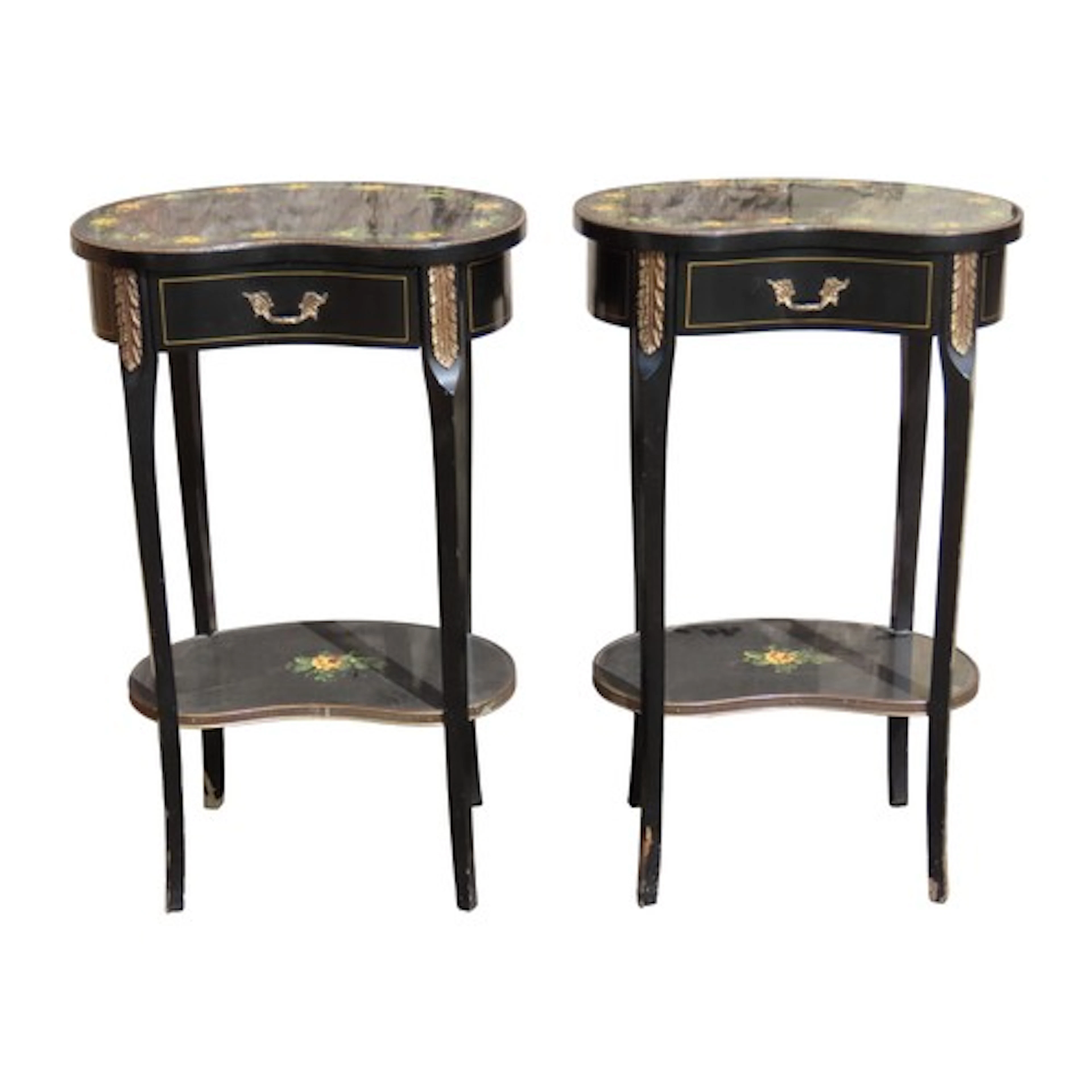 A pair of kidney-shaped occasional tables, each enclosing a ...