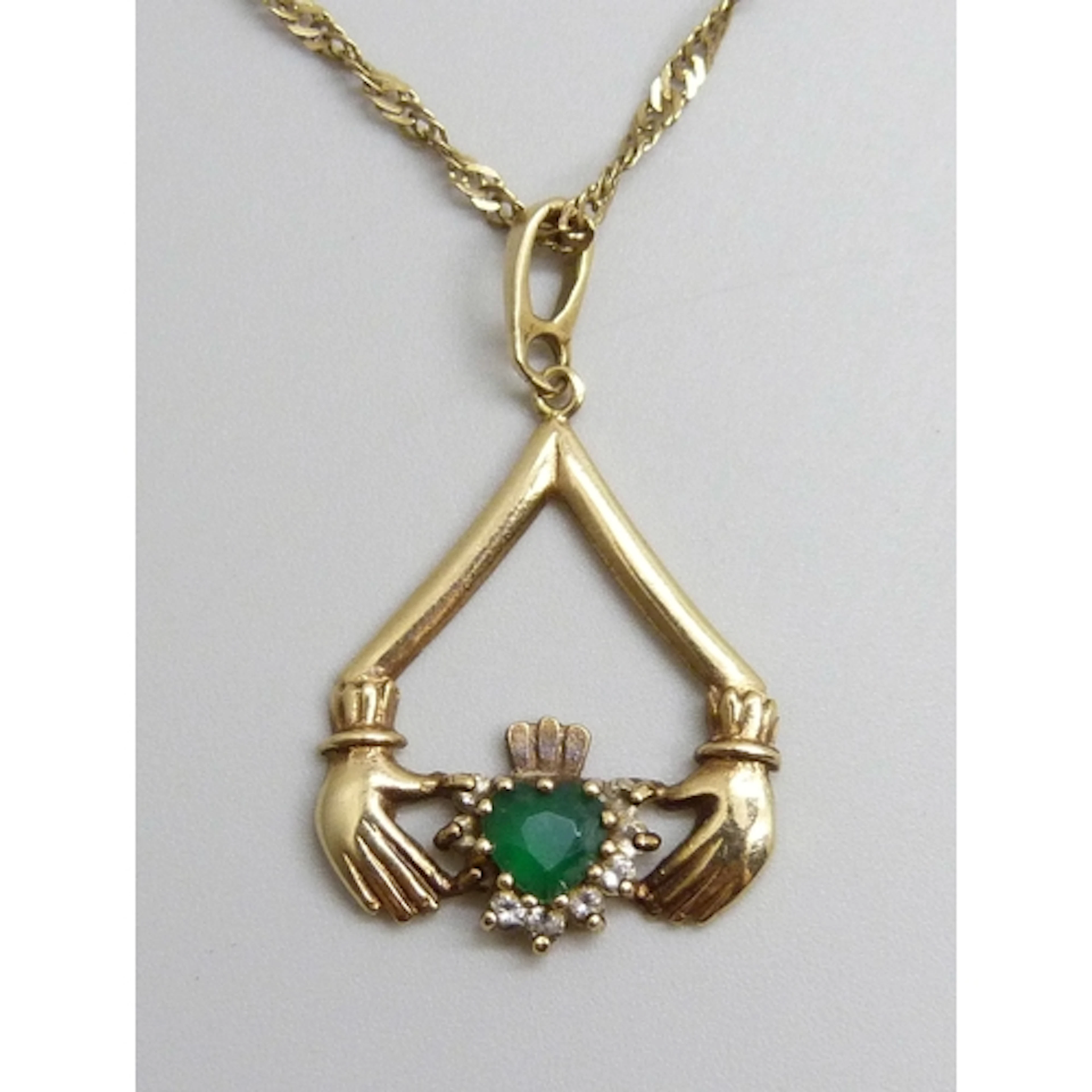 A 9ct gold Irish Claddagh design pendant, 3cm including bail...