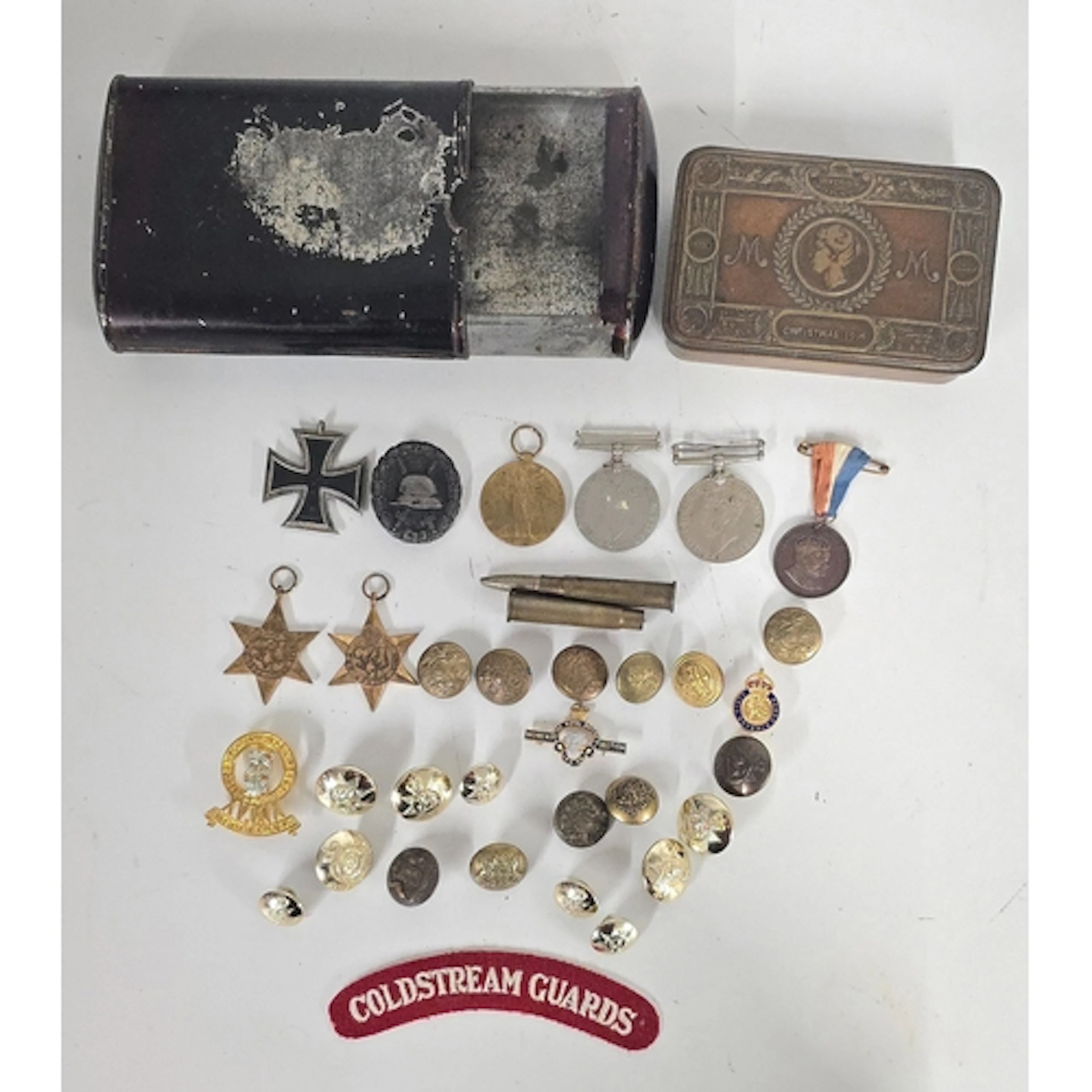WW1 Queen Mary tin with various items including a WW1 Victor...