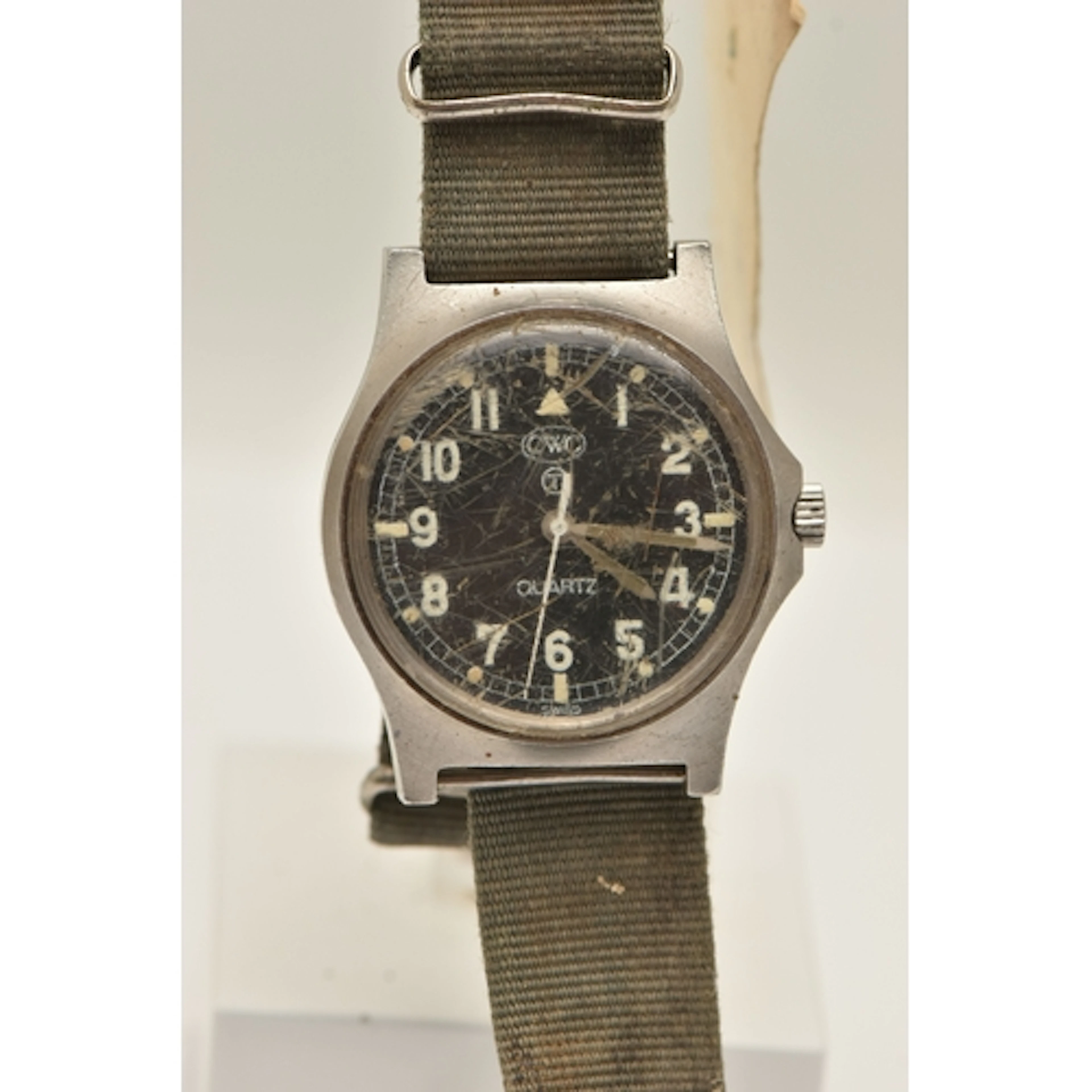 A MILITARY 'CWC' WRISTWATCH, quartz movement, round black di...