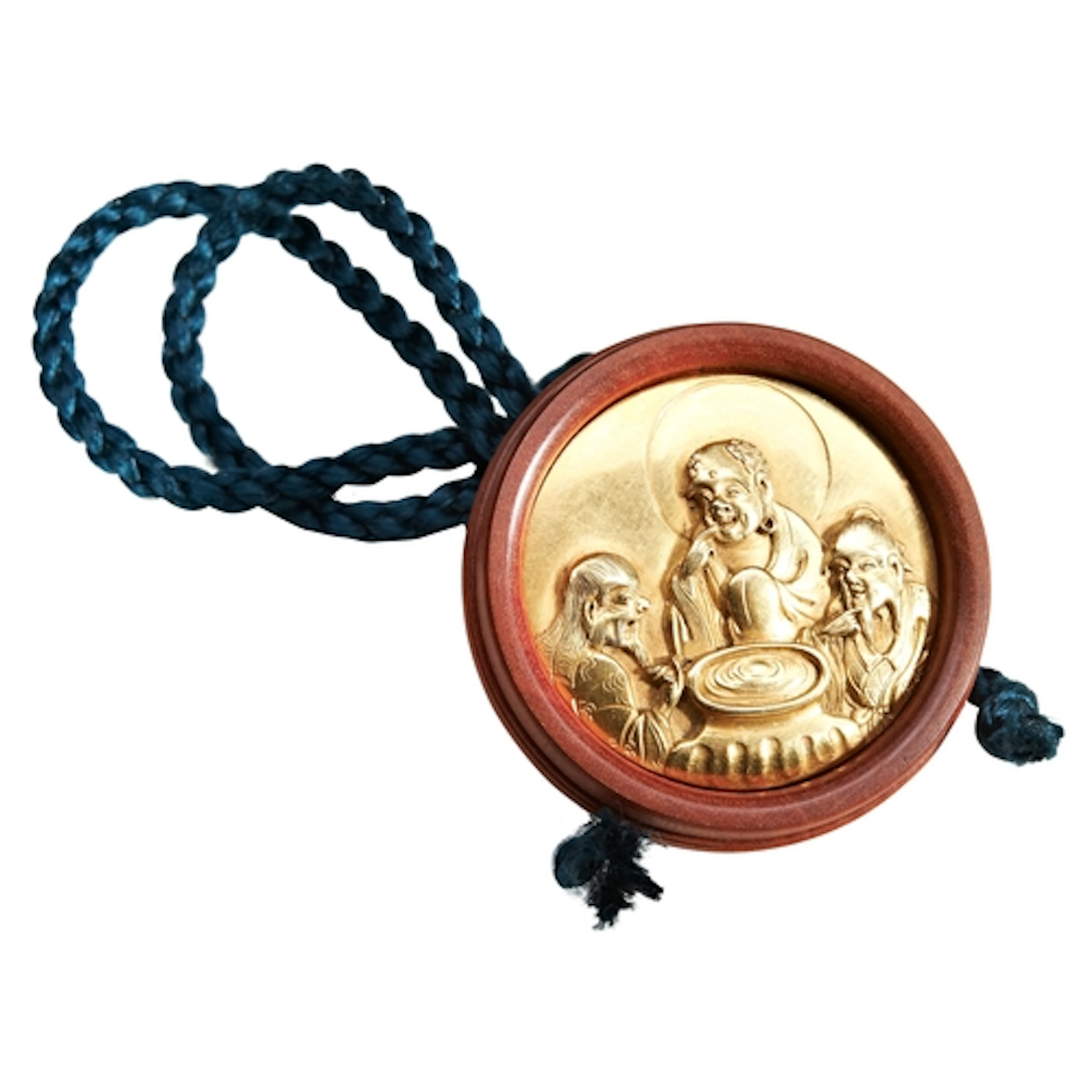 A JAPANESE GOLD AND TURNED WOOD KAGAMIBUTA NETSUKE BY YASUCH...