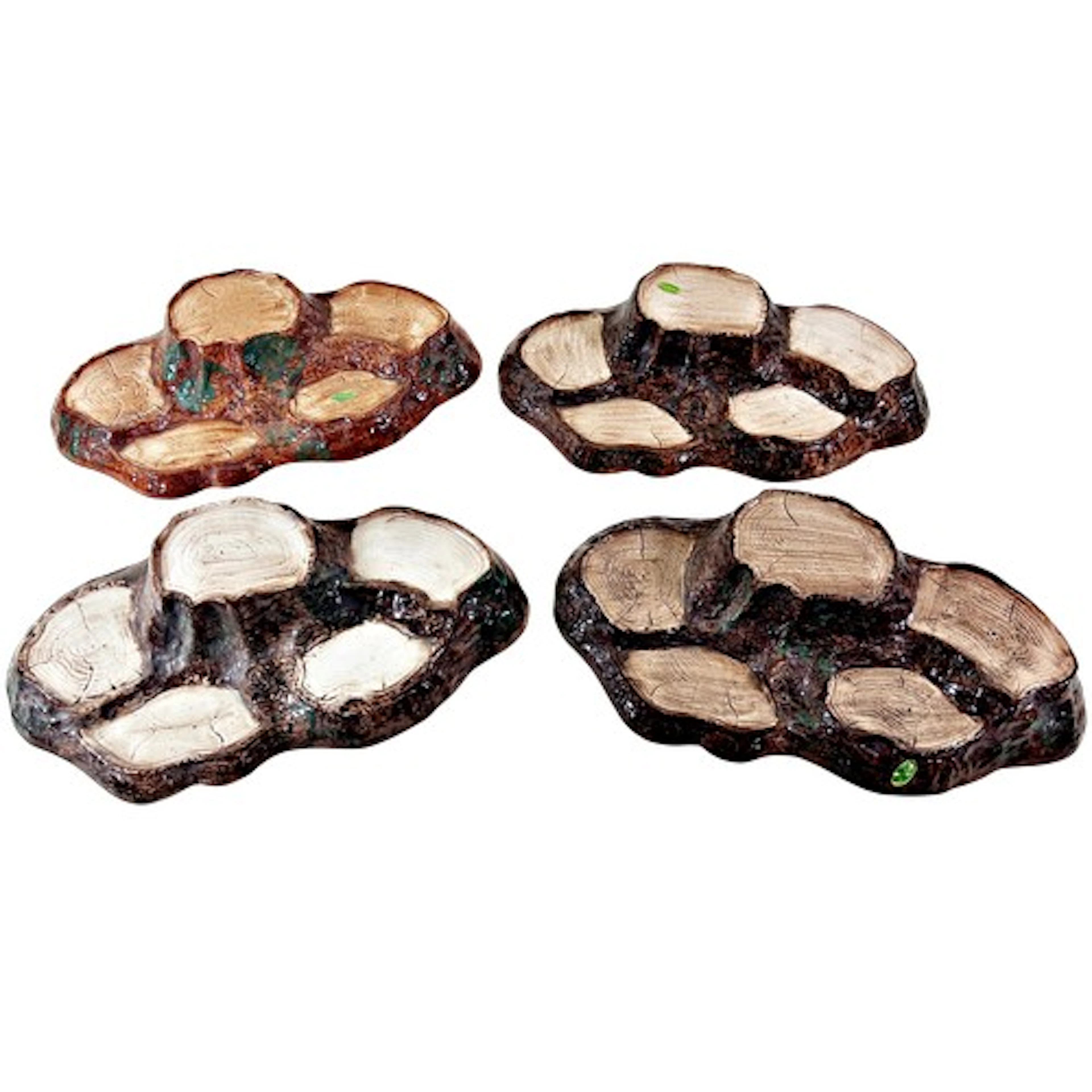 A collection of four Beswick ceramic figurines 'tree stump' ...