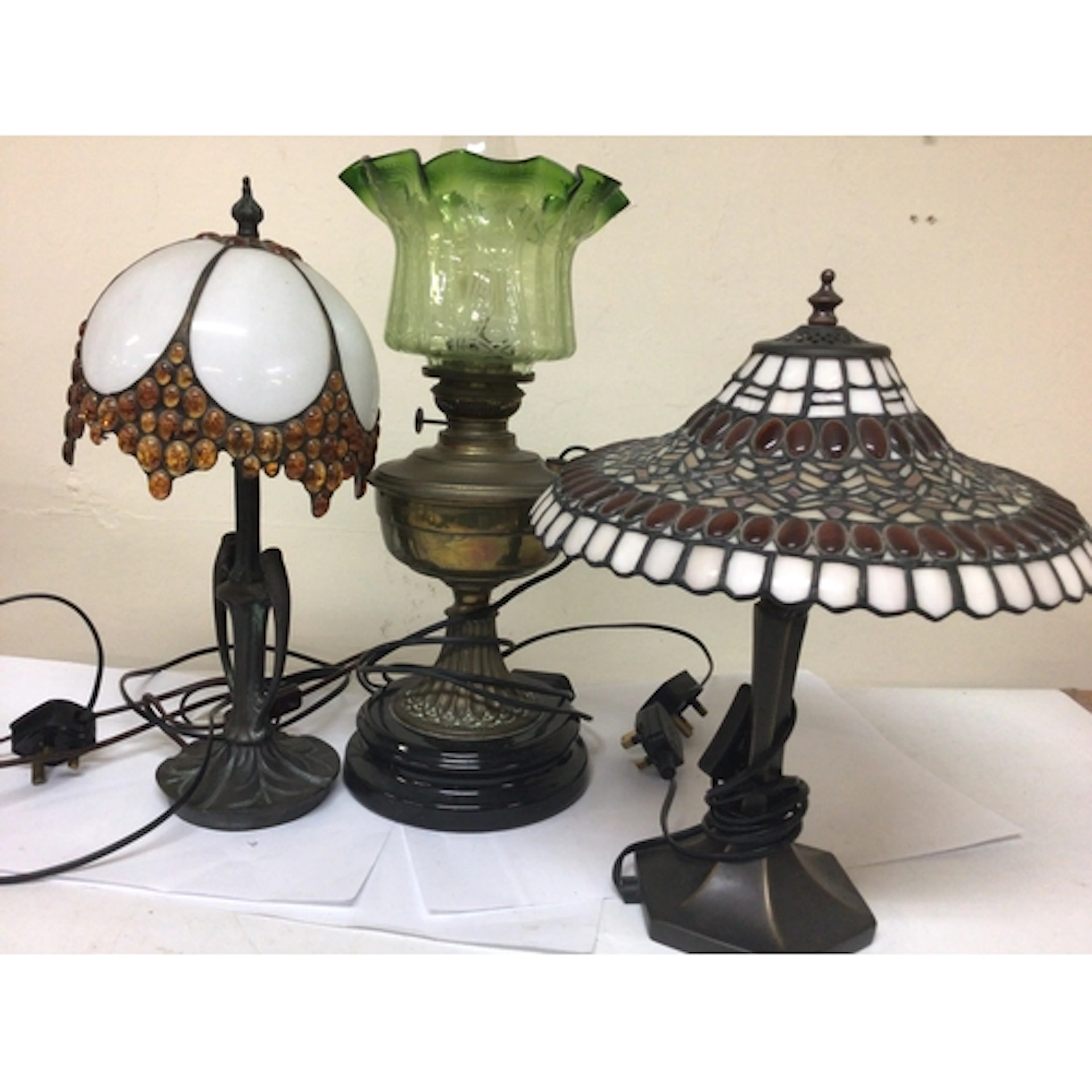 Two Tiffany style table lamps and a Converted Victoria...