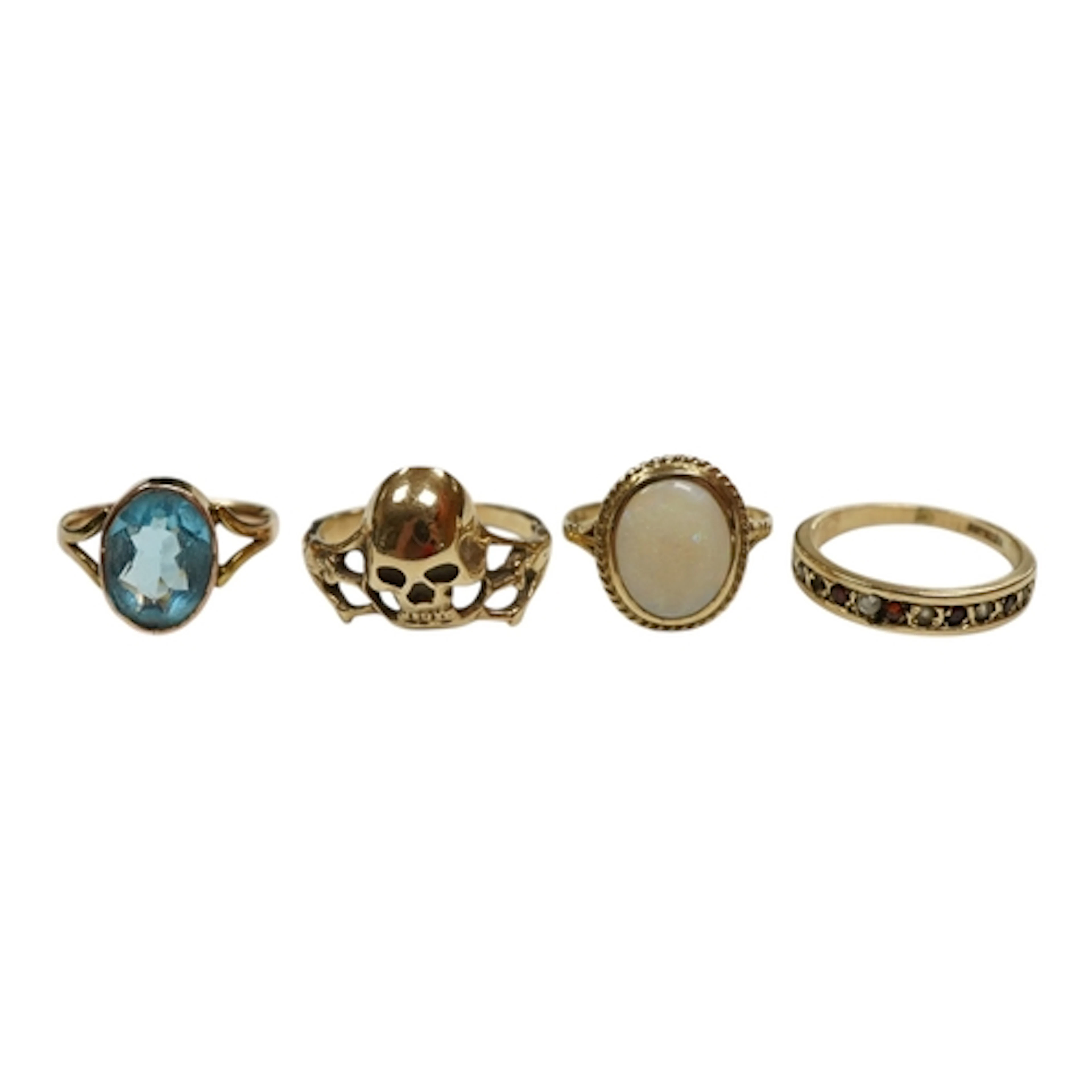 An unmarked yellow metal skull ring, size Q, together with a...
