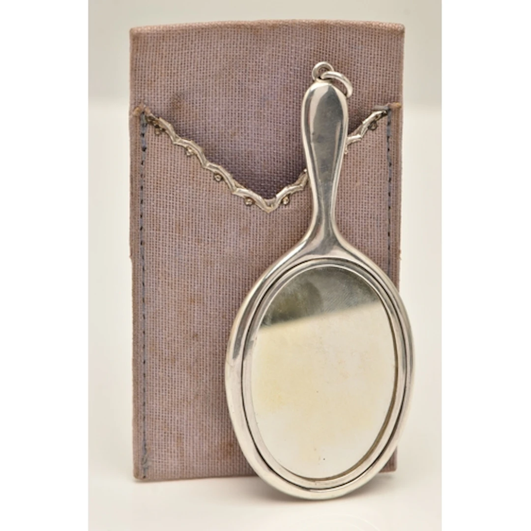 AN EARLY 20TH CENTURY SILVER MINIATURE HAND HELD MIRROR WITH...