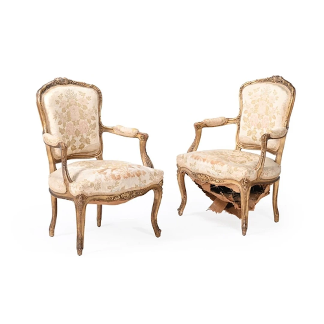 A pair of carved wood and gilt gesso fauteuils in Louis XV s...