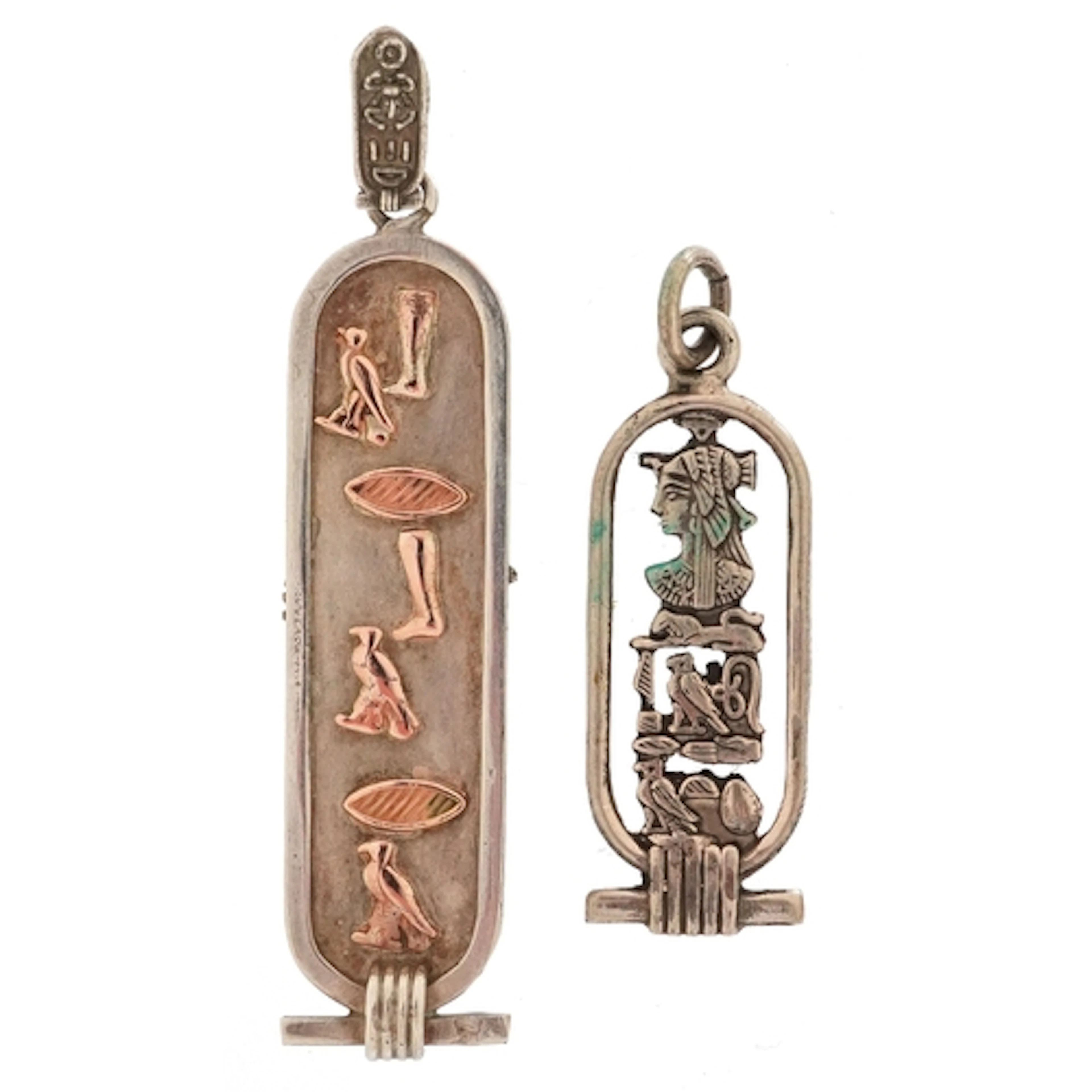 Two silver Egyptian hieroglyph pendants, the largest 5.7cm h...