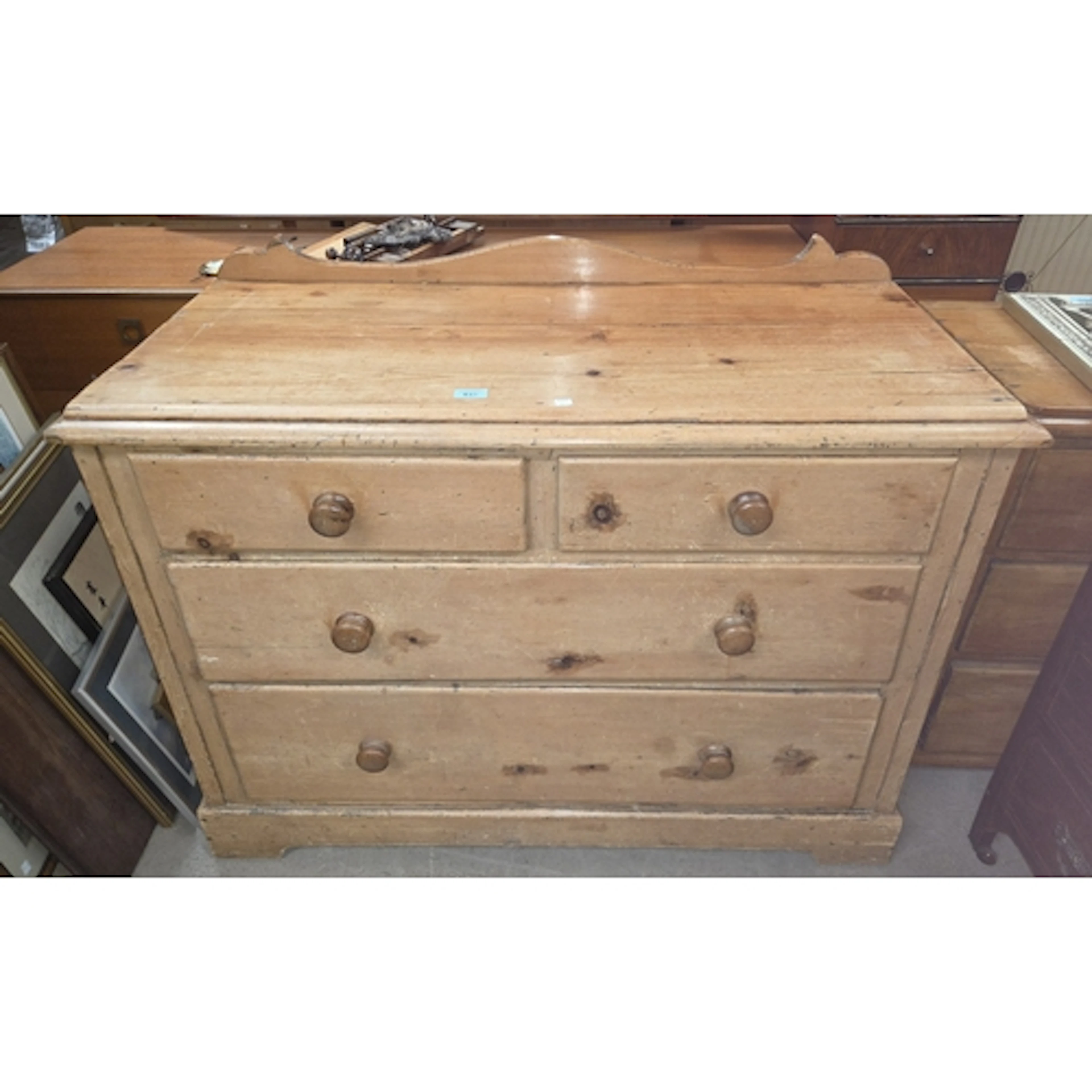 A Victorian pine chest of two long and 2 short drawers, bun ...