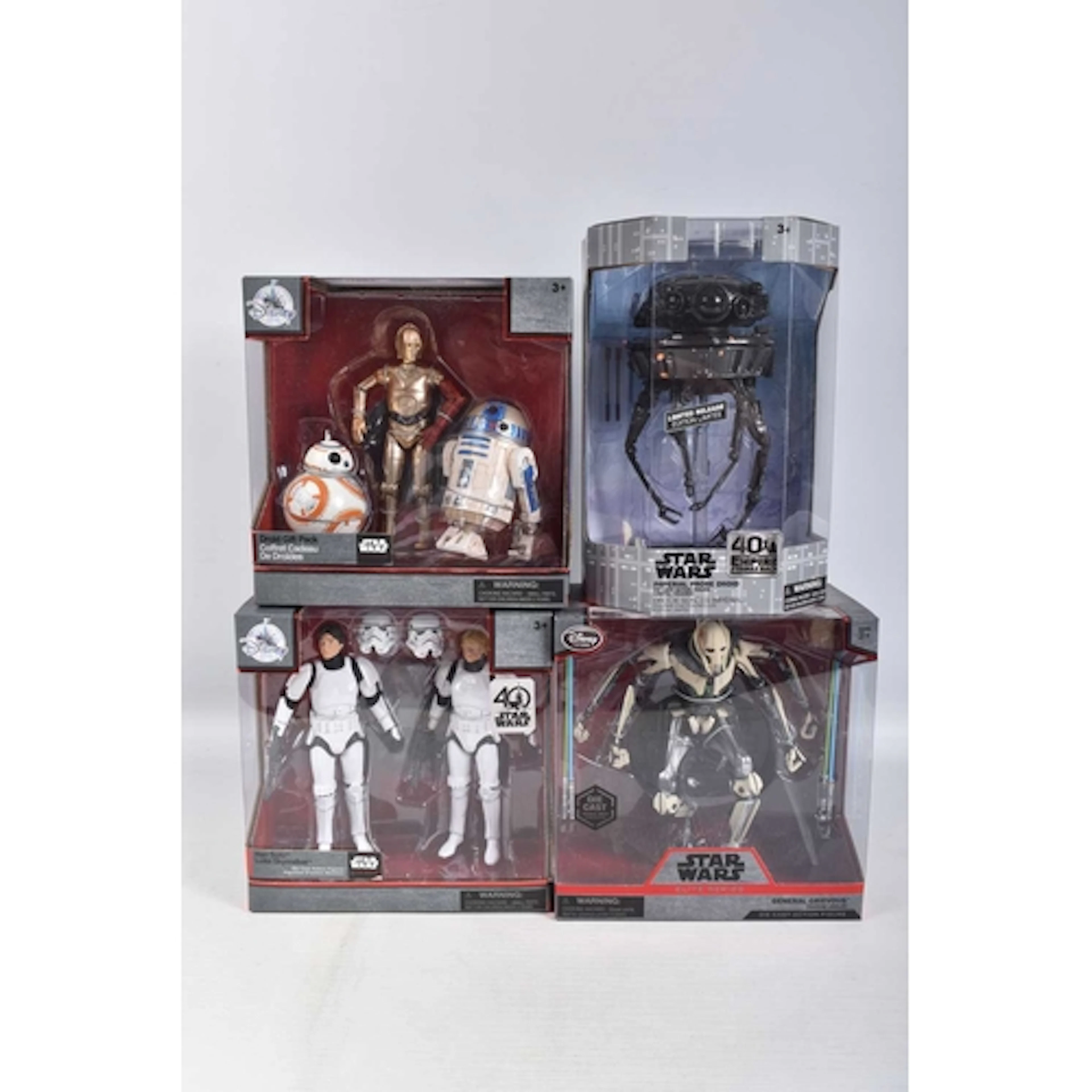 FOUR BOXED DISNEY STORE STAR WARS FIGURES, to include an eli...