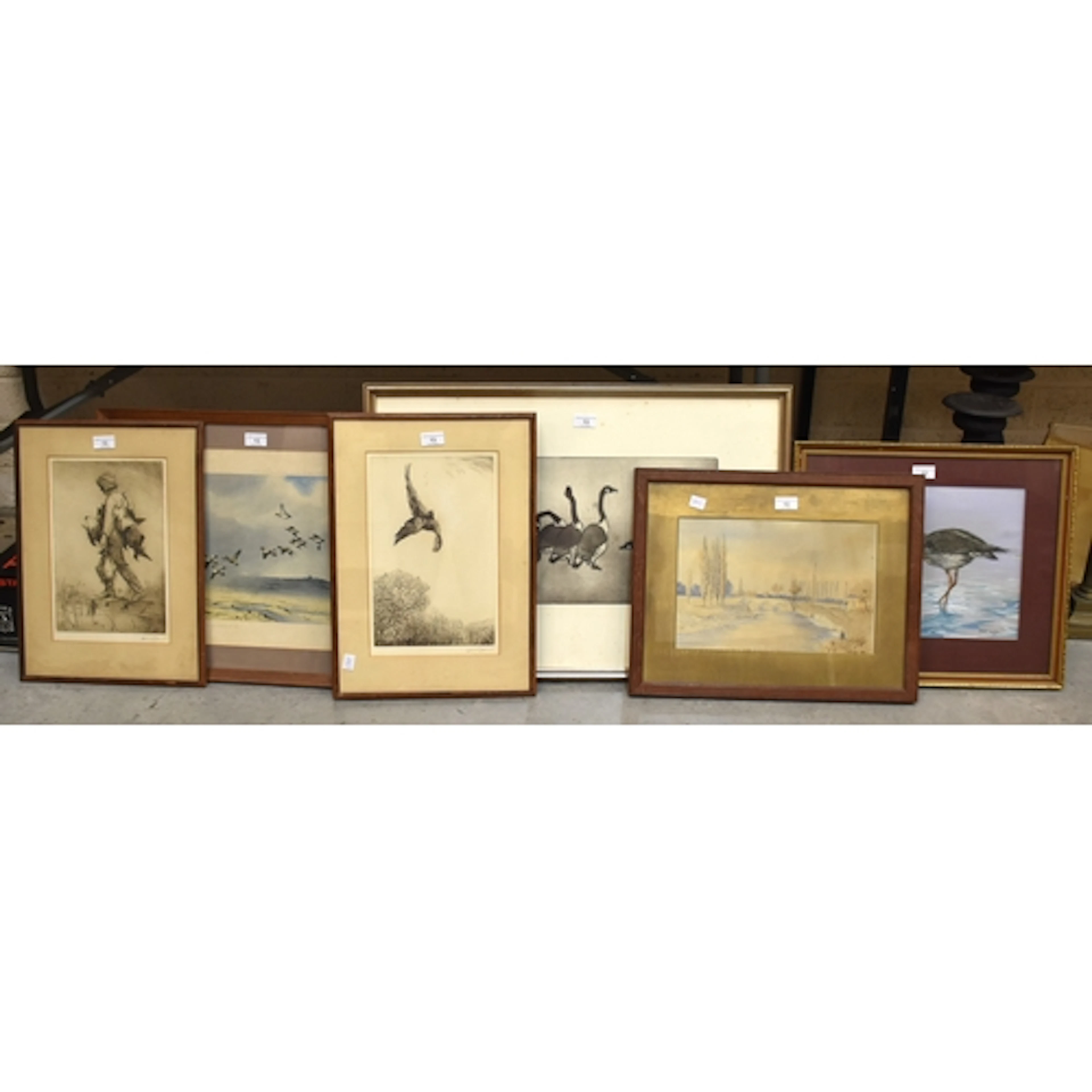 A framed limited-edition lithographic print depicting a smal...