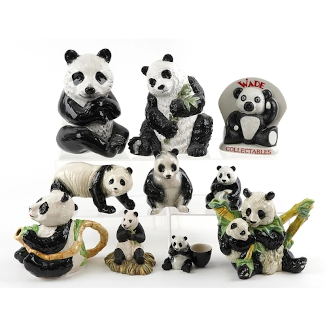 Collection of decorative porcelain pandas including Wade and...