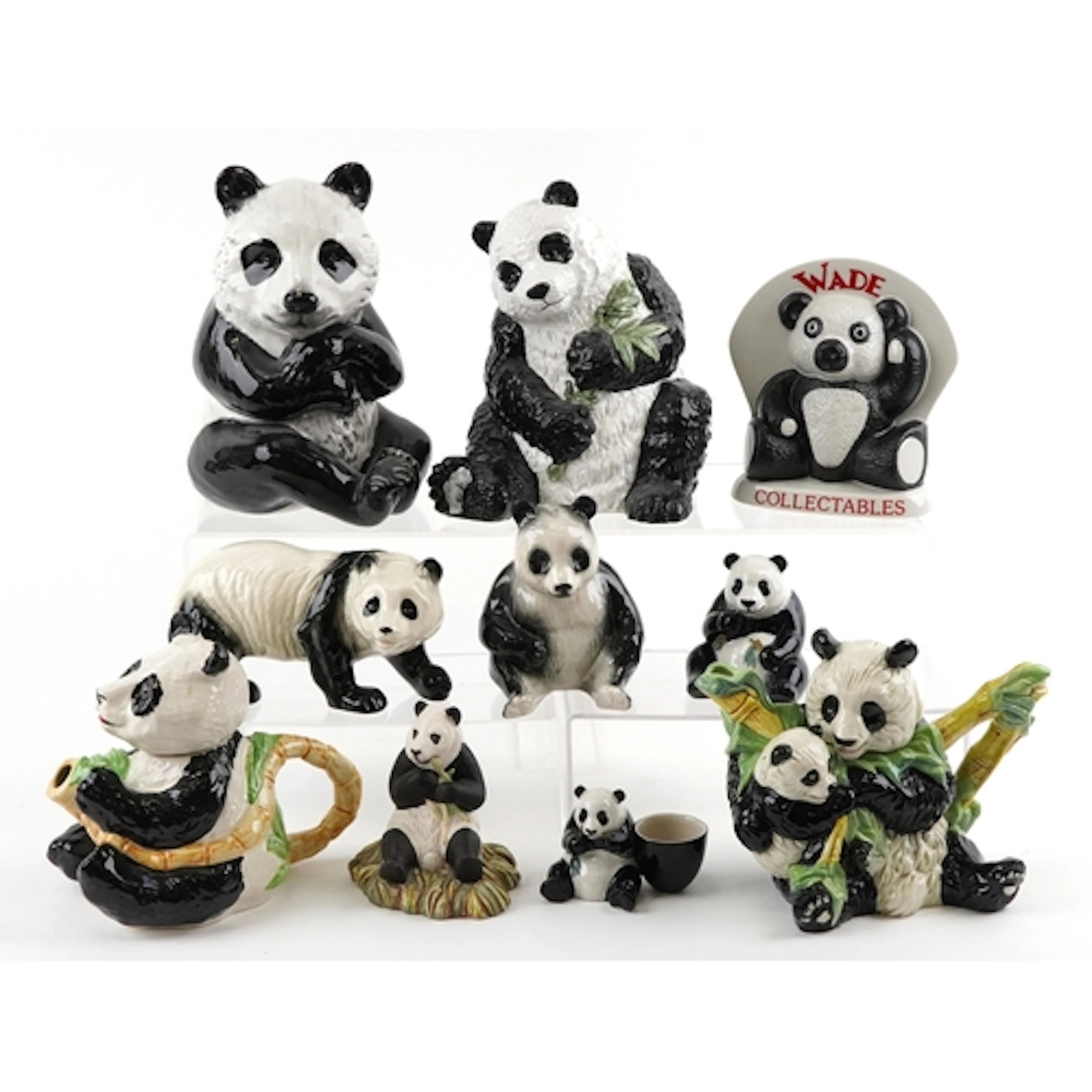 Collection of decorative porcelain pandas including Wade and...
