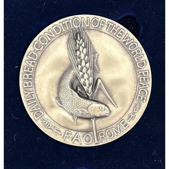 A pair of Food and Agriculture Organization boxed silver med...