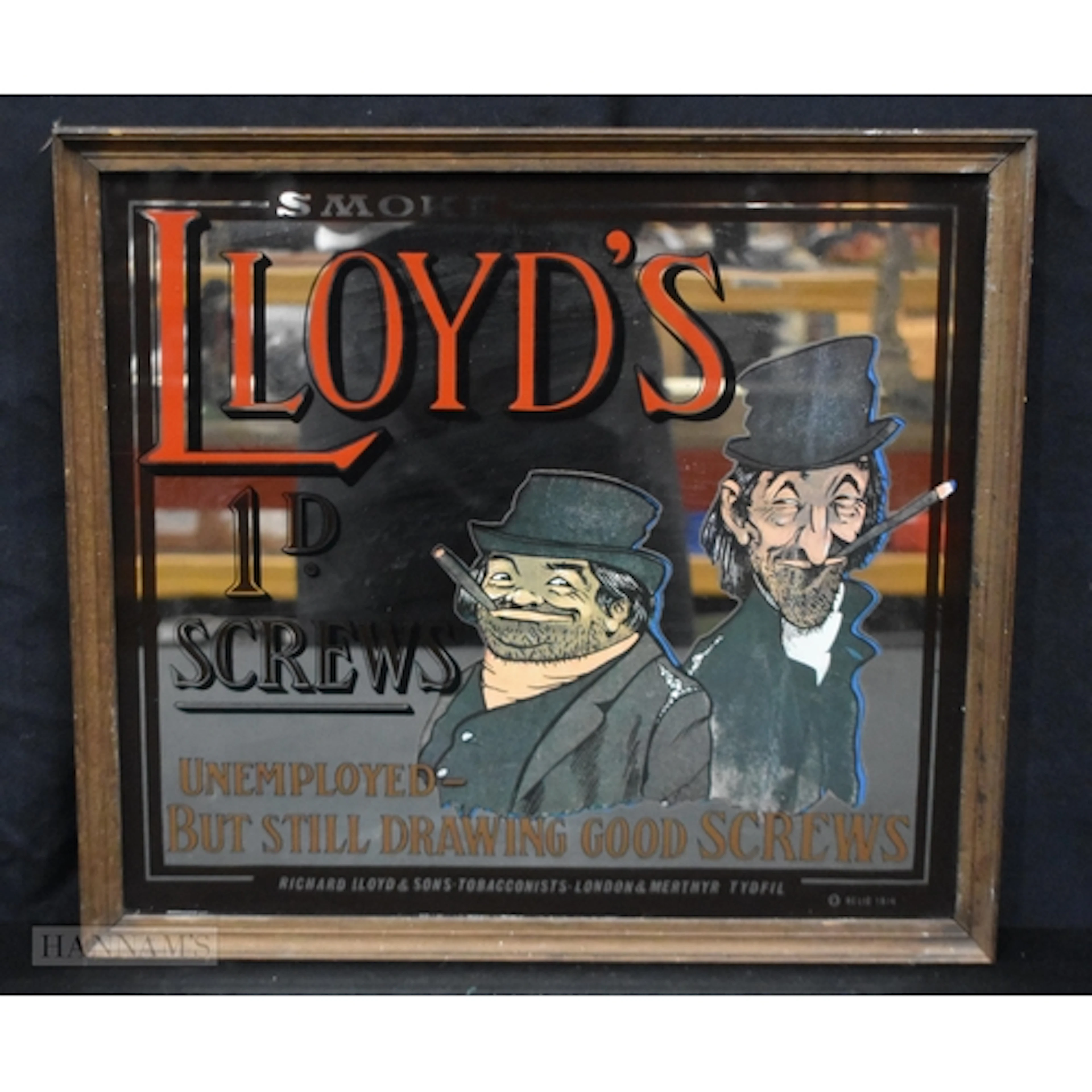 A framed vintage Lloyds Tobacconists mirror 42 x 47cm