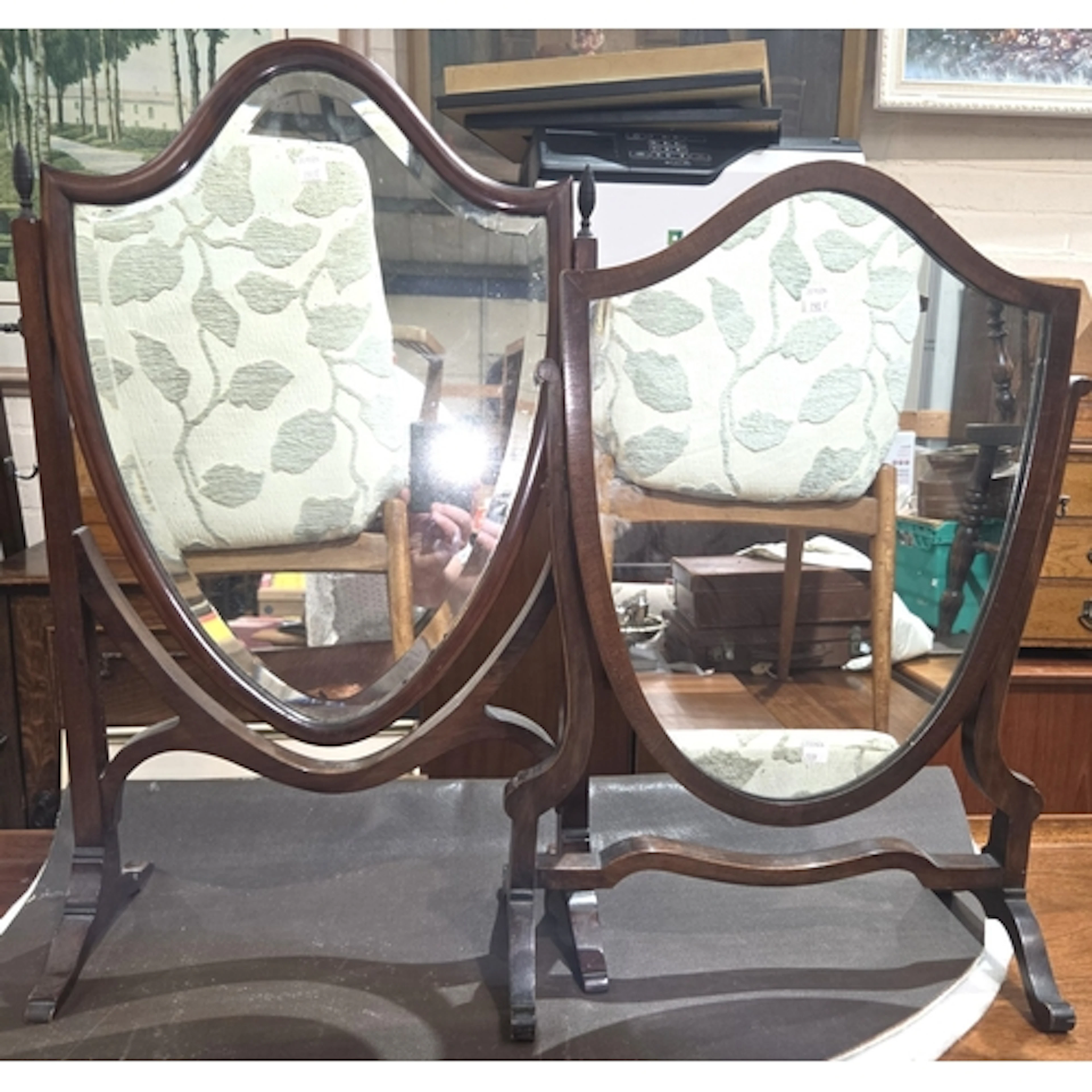 A pair of shield shape mahogany free standing dressing table...