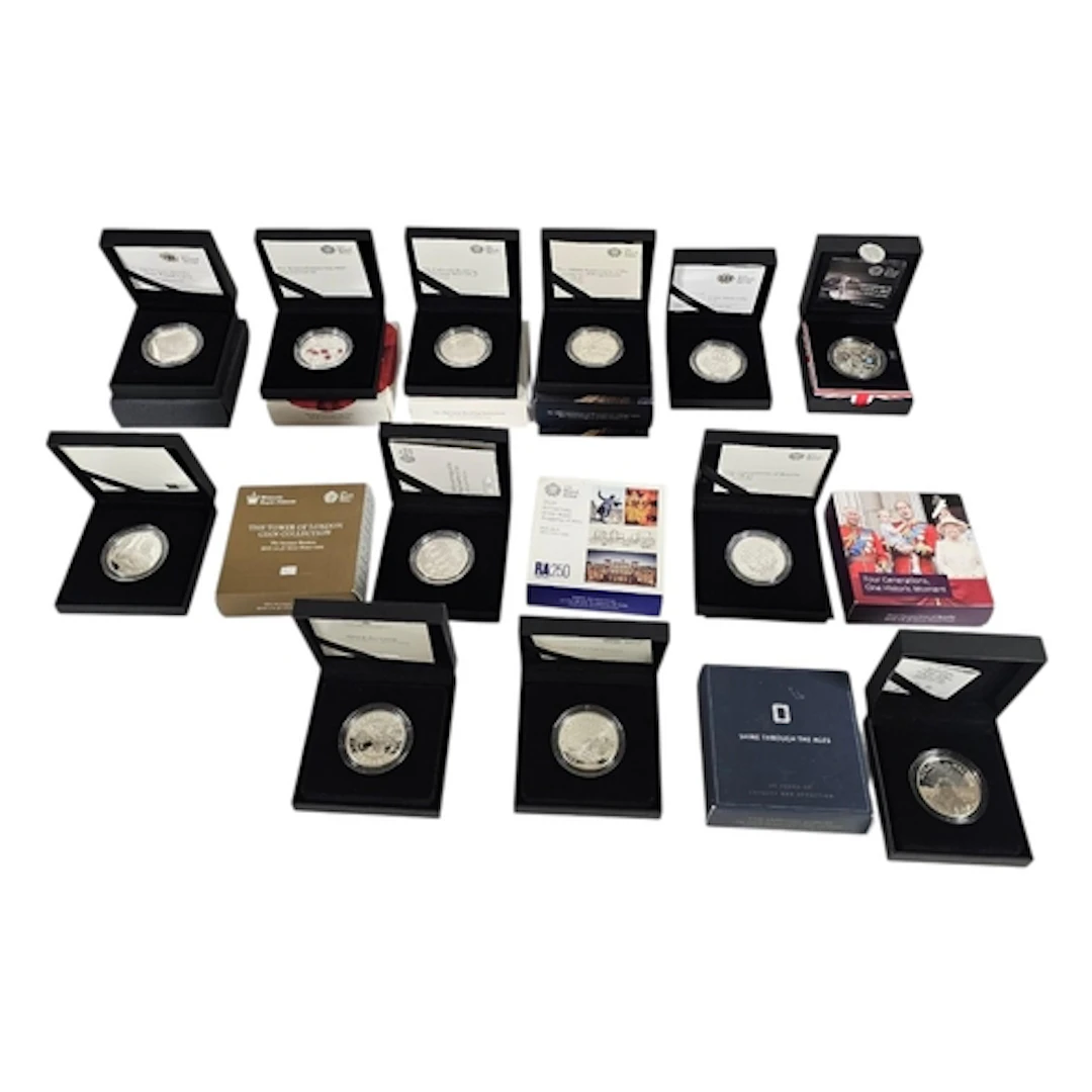 A COLLECTION OF TWELVE COMMEMORATIVE SILVER PROOF FIVE POUND...