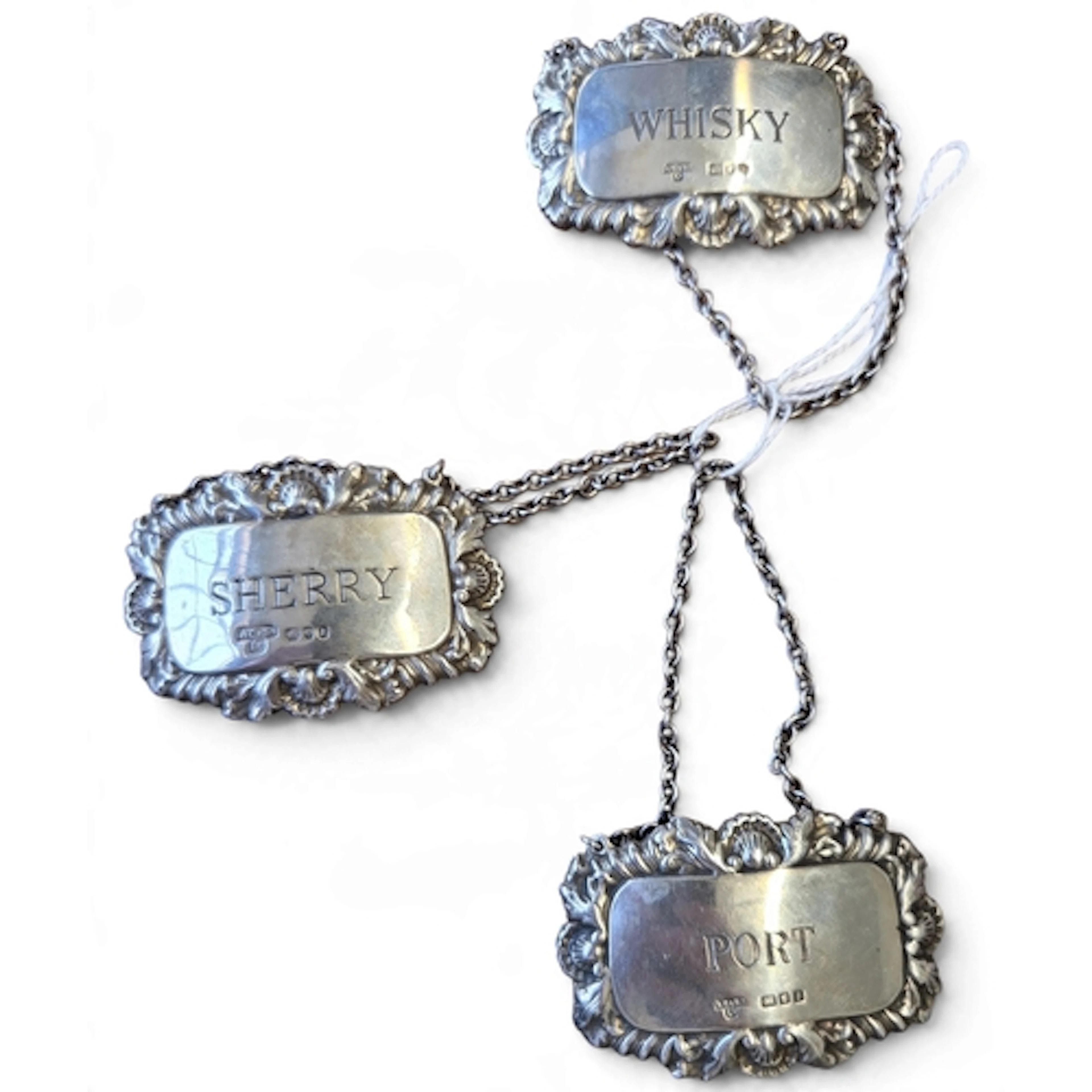 A lovely set of three Georgian style Silver spirit Labels wi...